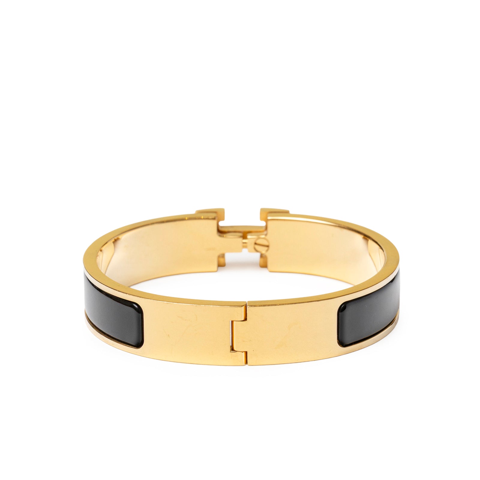 Back view of Hermès Clic H bracelet PM Black Gold Hardware with open clasp and black enamel panels