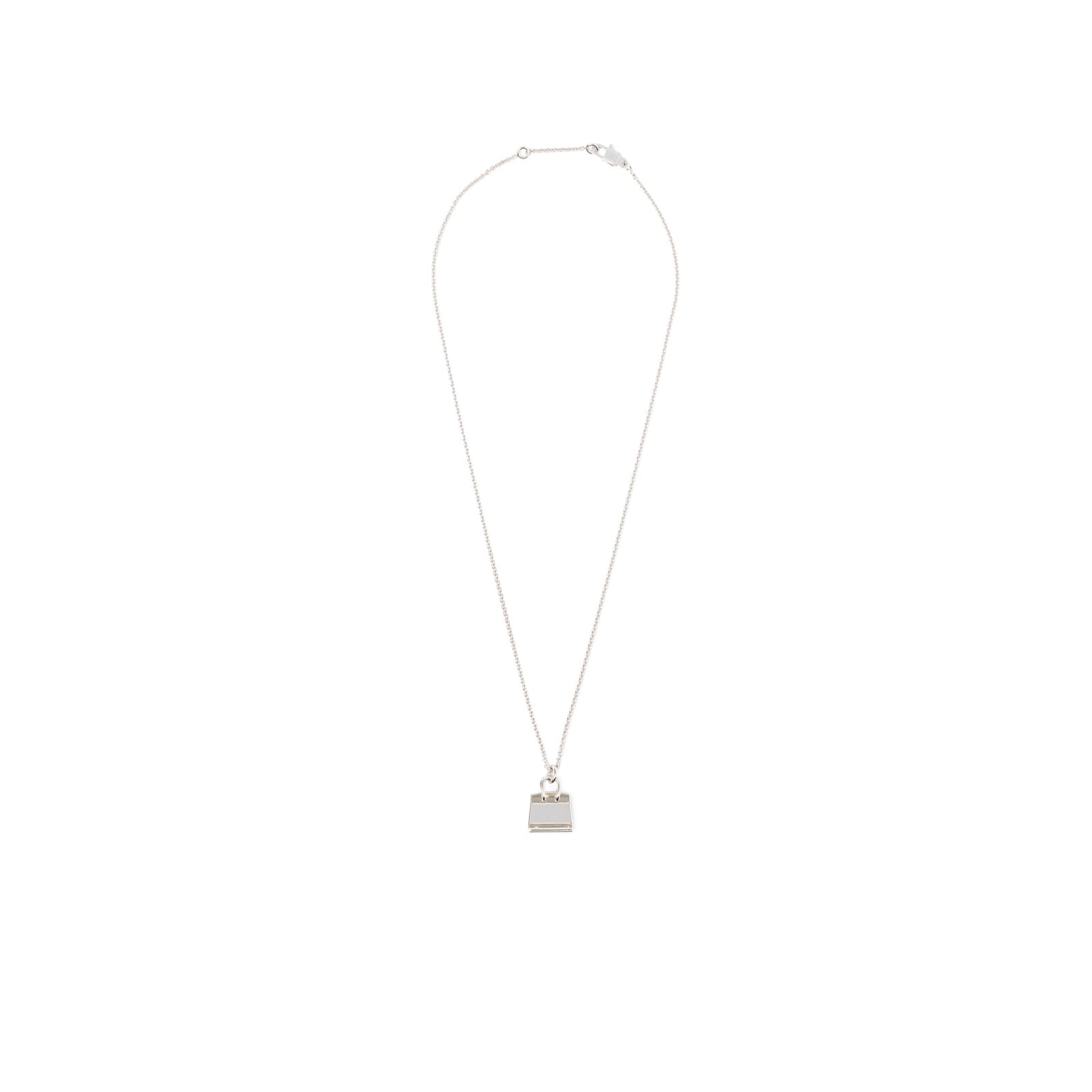 Top-down view of Hermès Amulettes Birkin Pendant Diamonds and 18k White Gold with thin chain and lock-shaped motif