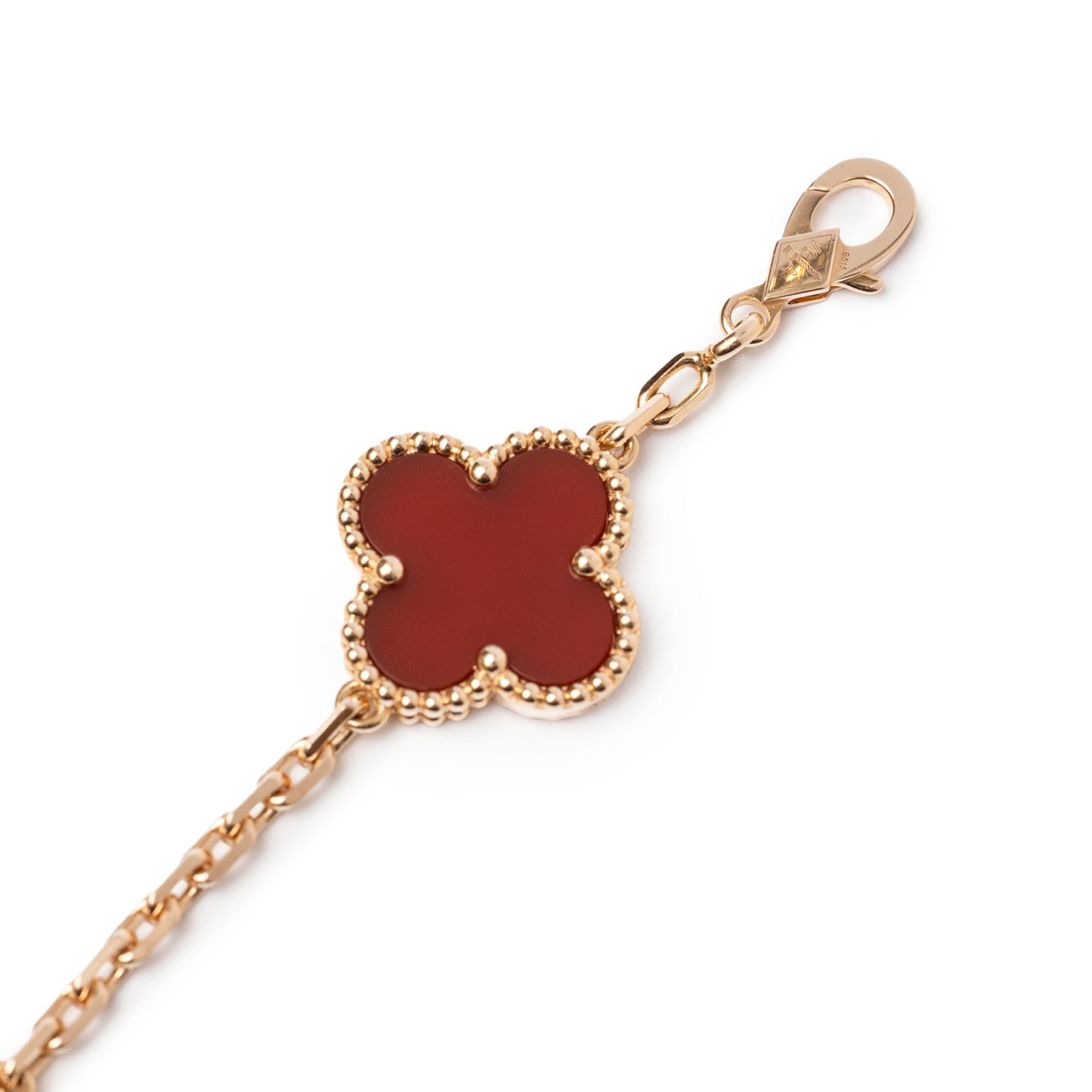 Close-up angled view of Van Cleef & Arpels Vintage Alhambra 5 Motifs Bracelet 18K Rose Gold Carnelian/Guilloche clasp and motif detail