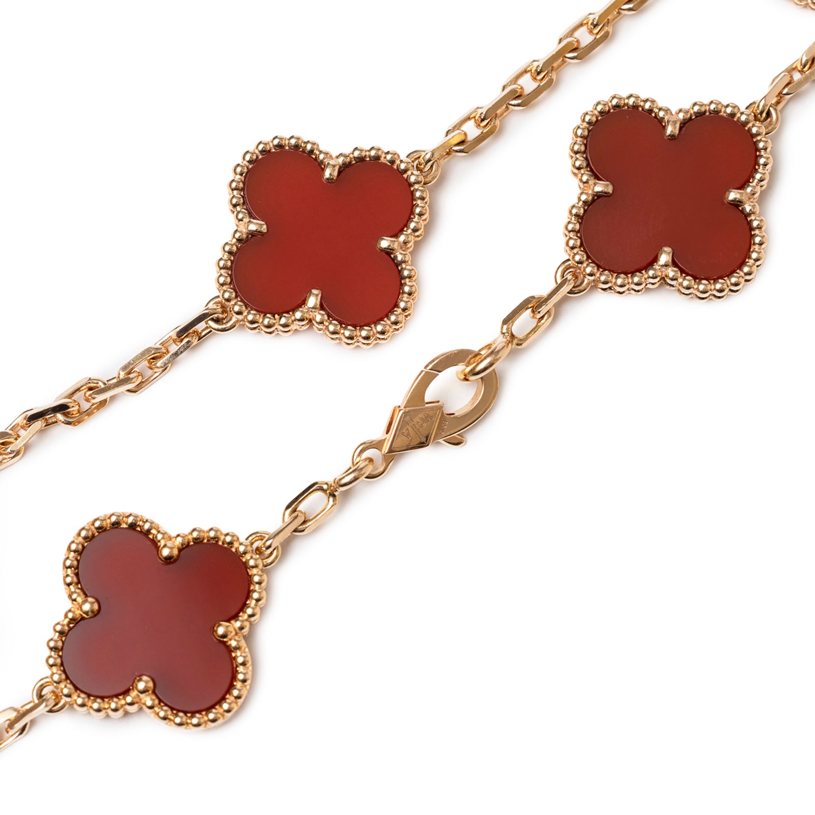 Close-up top view of Van Cleef & Arpels Vintage Alhambra 5 Motifs Bracelet 18K Rose Gold Carnelian Guilloche with clasp visible