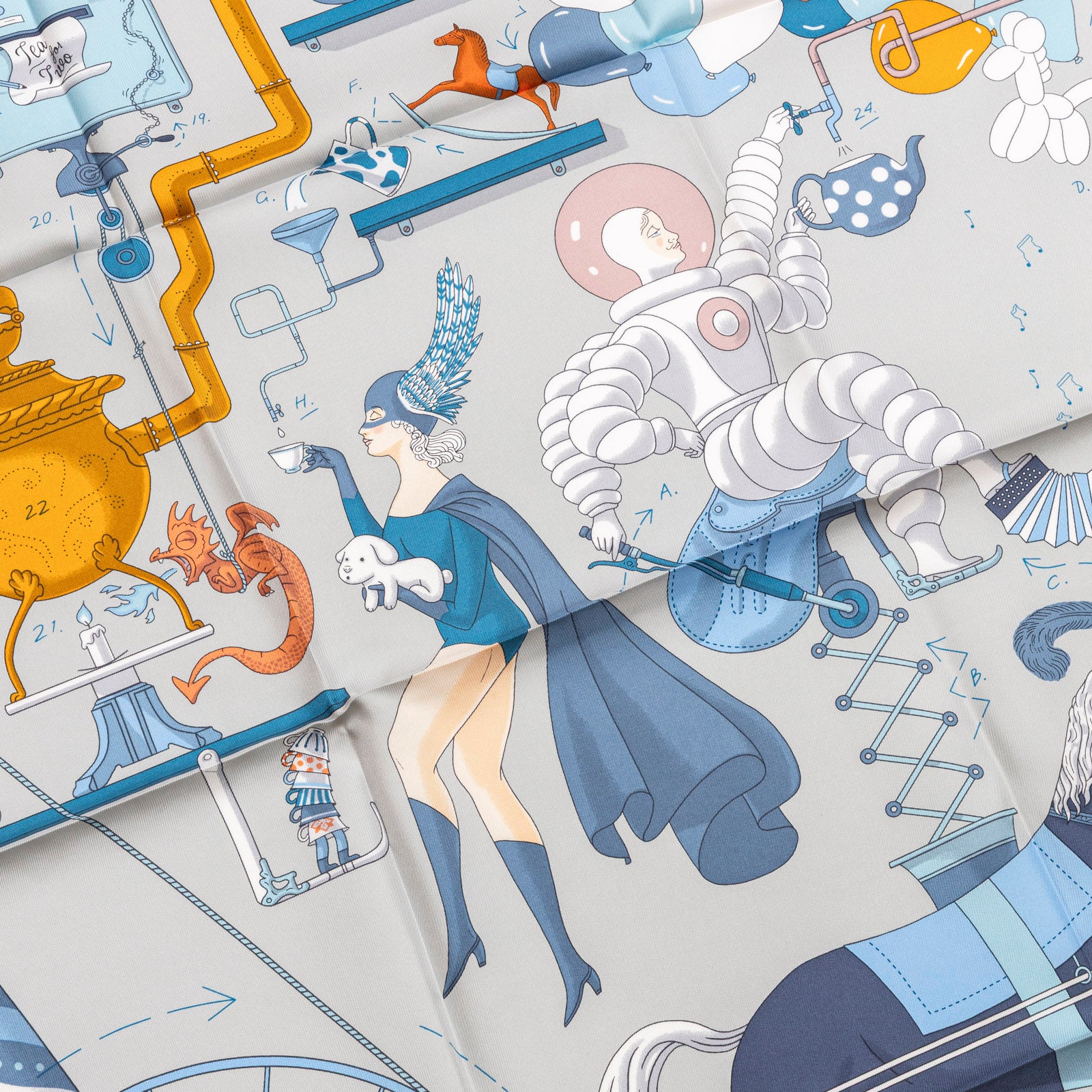 Close-up front view of Hermès Carre Scarf 90 Tea for Two Gris Perle Blue Ciel Blue Jean with whimsical figures