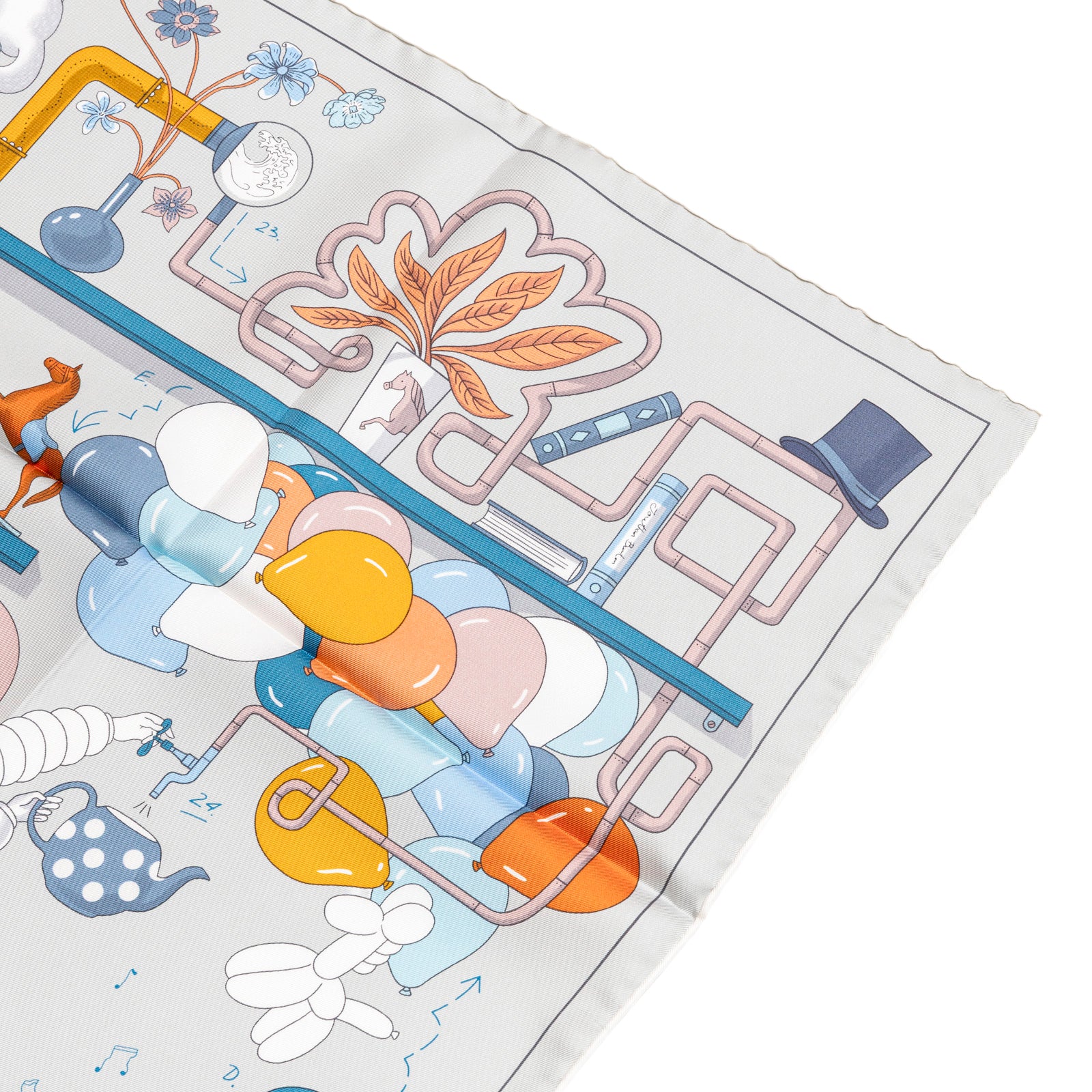 Angled close-up showing detailed colorful tea-themed design on Hermès Carre Scarf 90 Tea for Two Gris Perle/Blue Ciel/Blue Jean