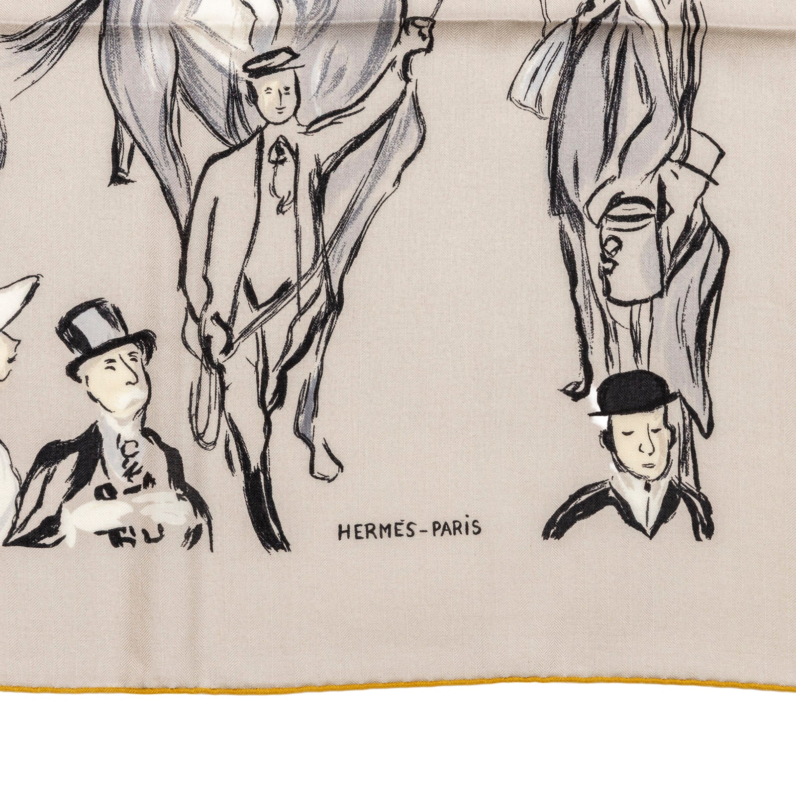 Close-up of Hermès Paddock Shawl 140 Gris Etain/Blue Marine/Nacre showing signature and hand-drawn equestrian figures