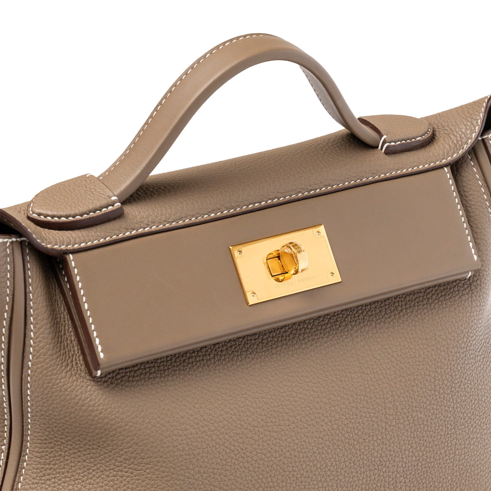 Close-up view of Hermès 24/24 29 Etoupe Togo and Swift Gold Hardware showing handle and clasp details