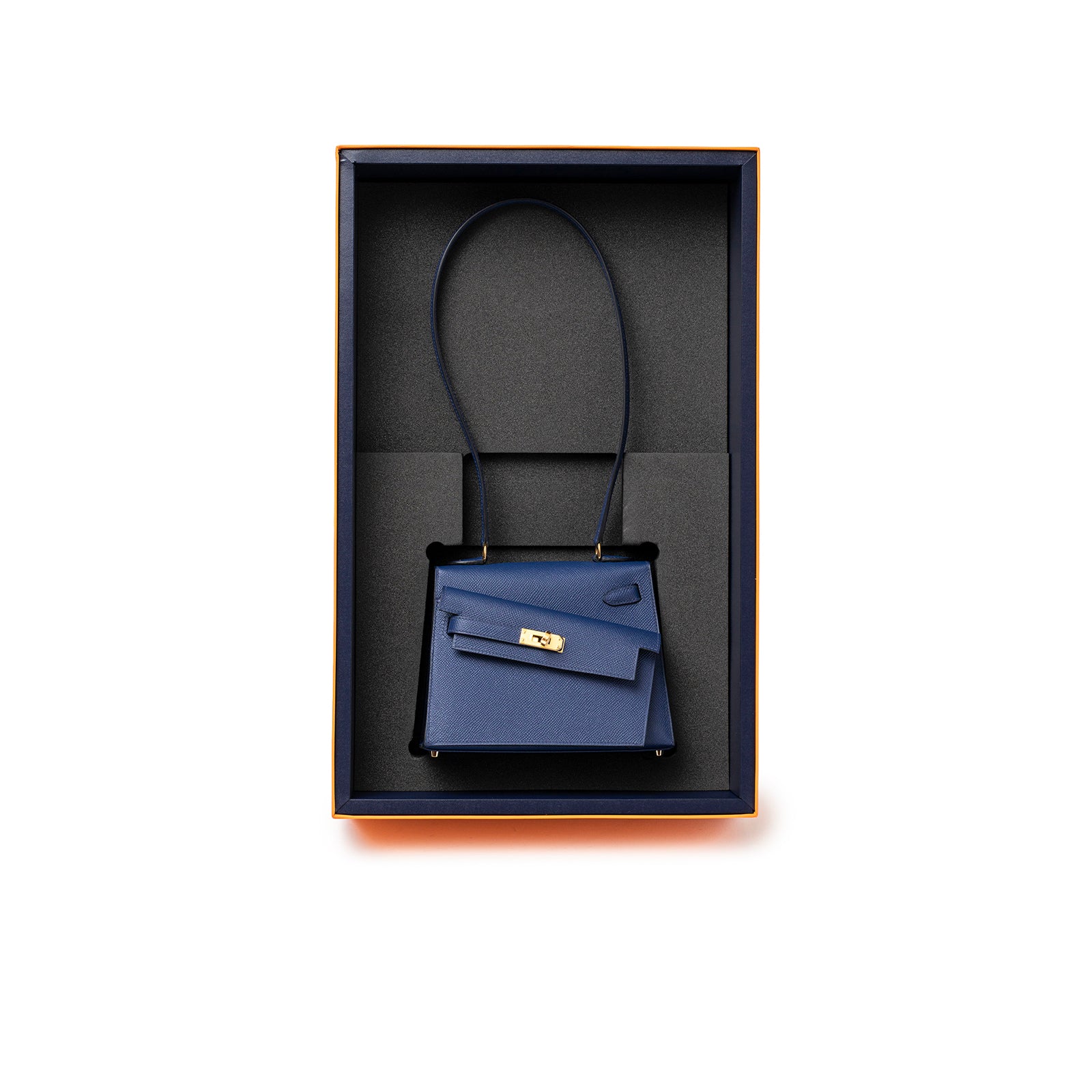 Top view of Hermès Kelly Desordre 20 Sellier Blue Saphir Epsom Gold Hardware in original box with strap visible