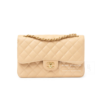 Front view of Chanel Classic Flap Jumbo Caviar Beige Gold Hardware bag with quilted pattern and chain strap