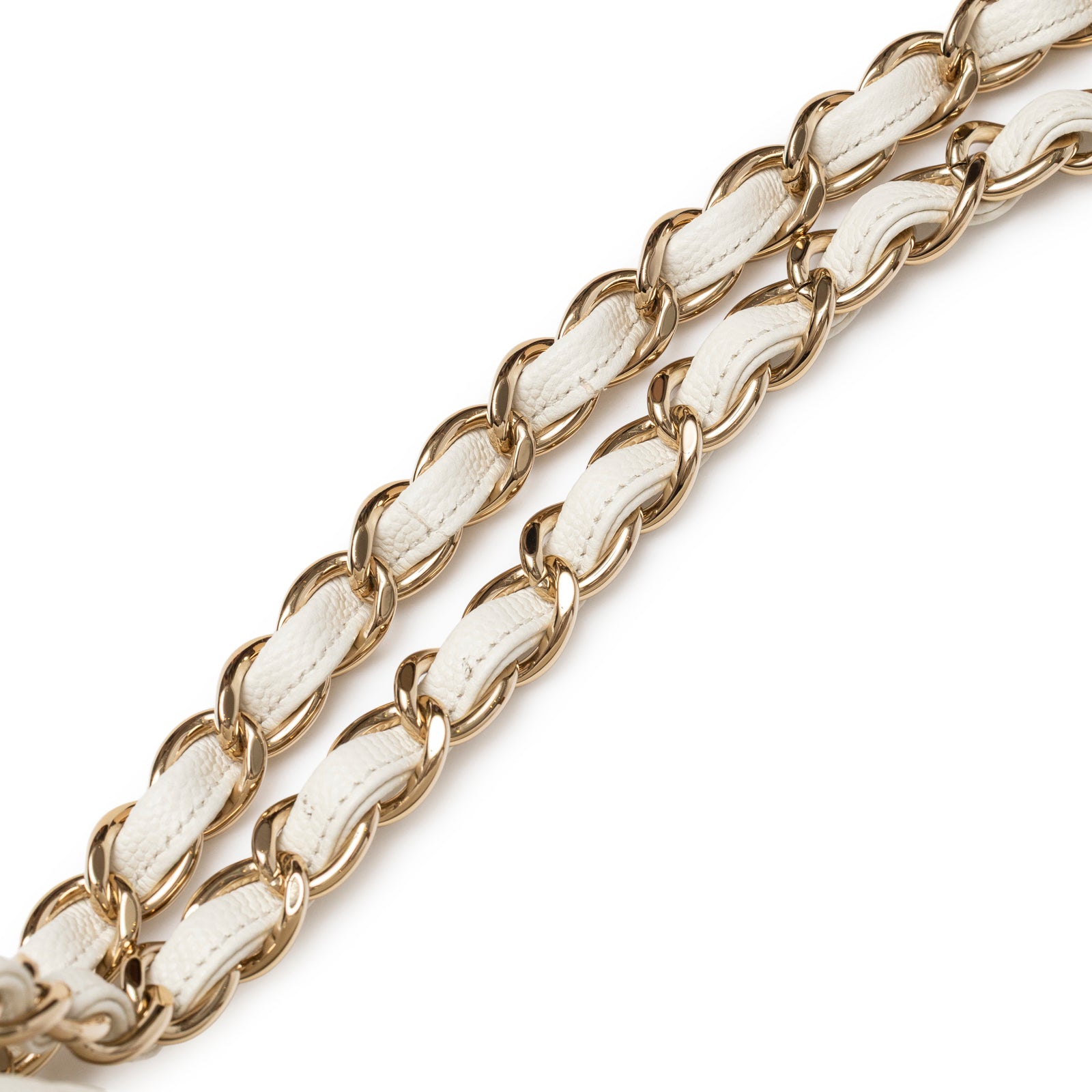 Close-up of white leather and gold chain strap detail on Chanel Classic Flap Maxi Caviar White Gold Hardware