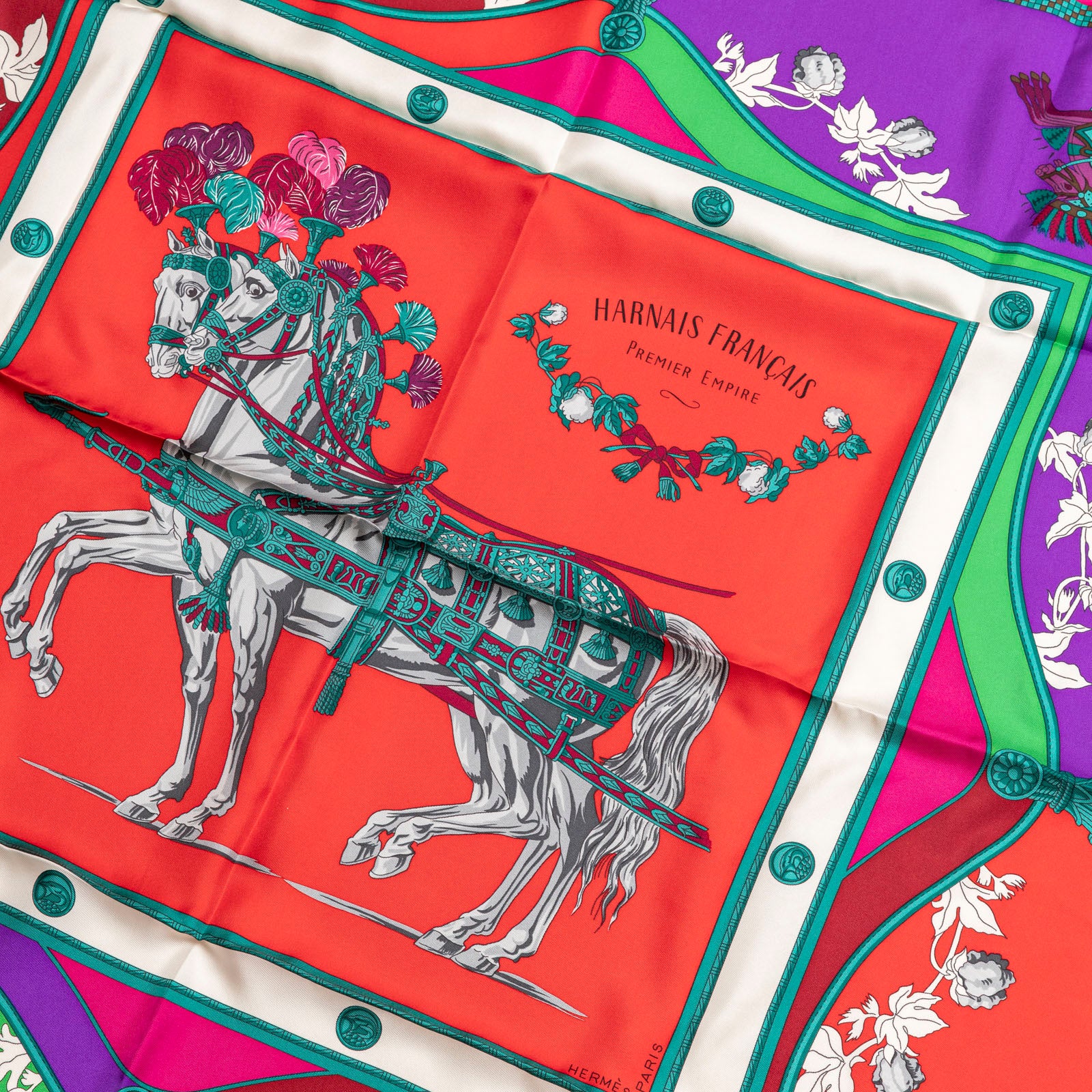 Close up detail of Hermès Carre 90 Harnais Francais Silk Scarf in Rouge Vert Multicolor