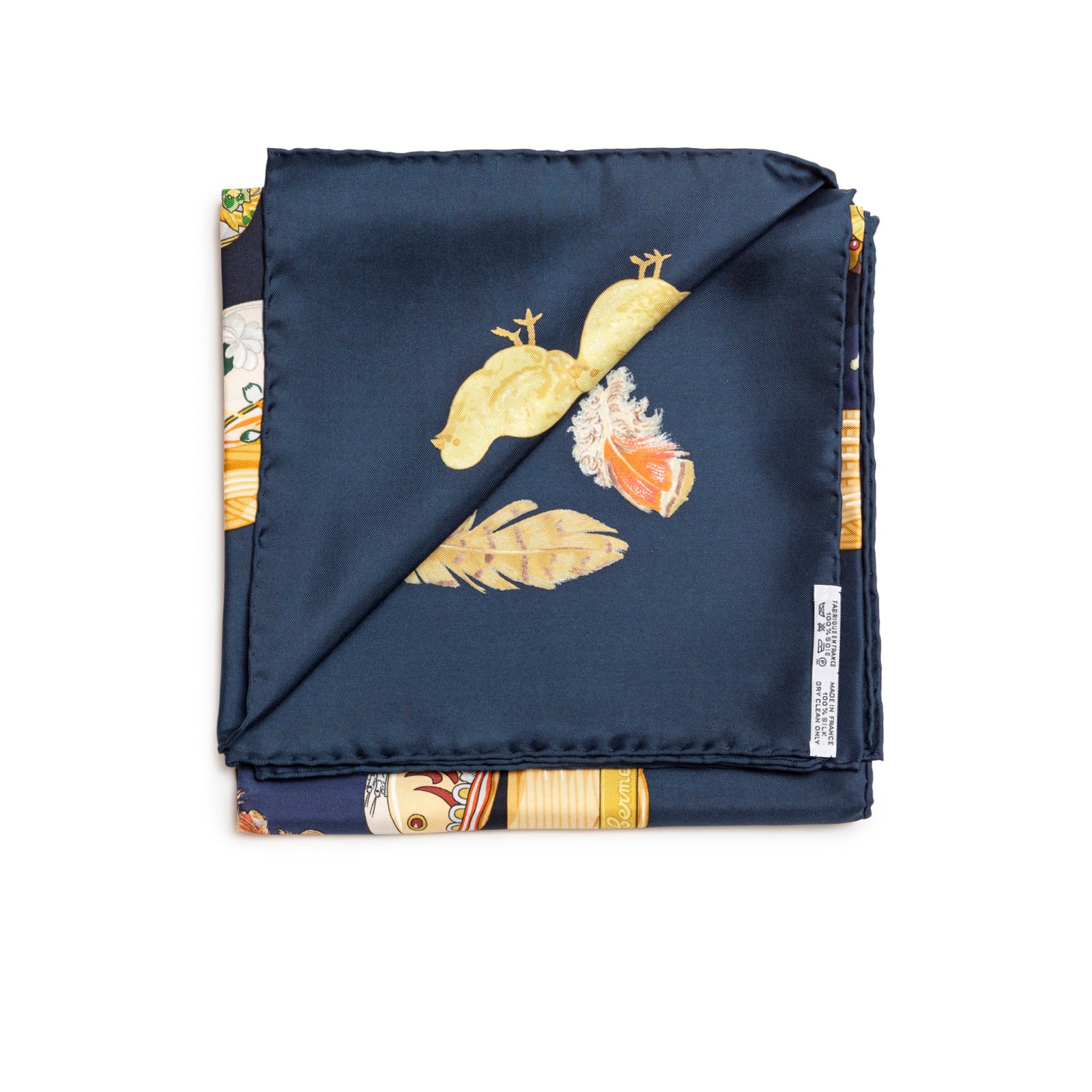 Folded view of Hermès Carre 90 Couvee d'Silk Scarf Blue Multi showing navy and detailed feather and bird design