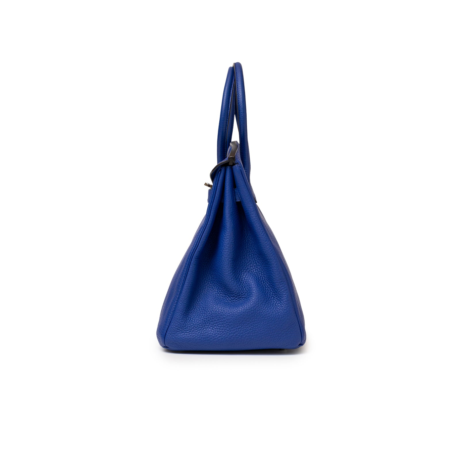 Side view of a luxurious Hermès Birkin 35 Blue Electric Togo Palladium Hardware handbag showcasing its structured silhouette and fine leather texture