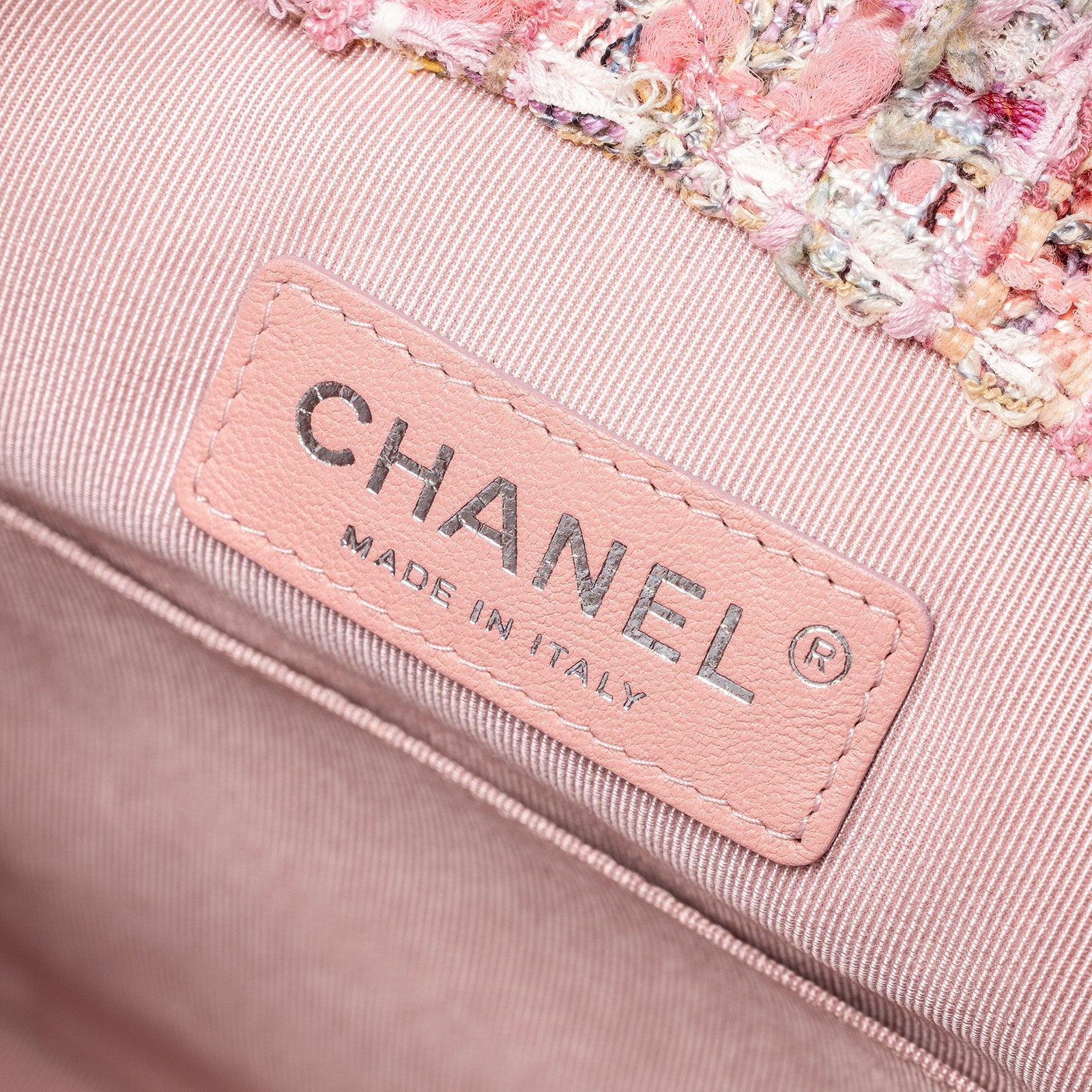 Close-up interior view of Chanel 19S Backpack Pink Tweed Palladium and Gold Hardware label tag inside the bag