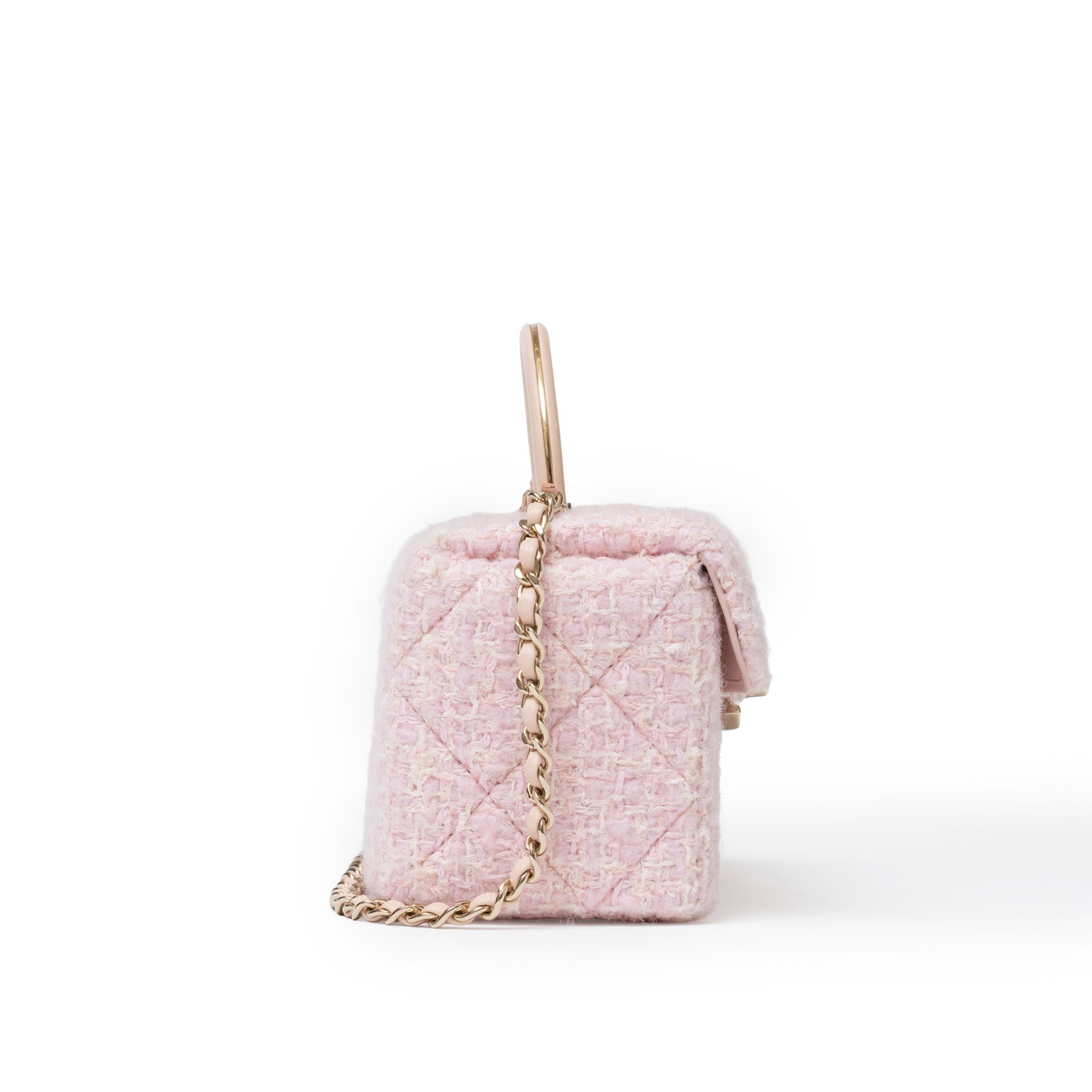 Side view of Chanel 23K Top Handle Vanity Box Tweed Chain Bag Pink Permabrass Hardware showing textured detail