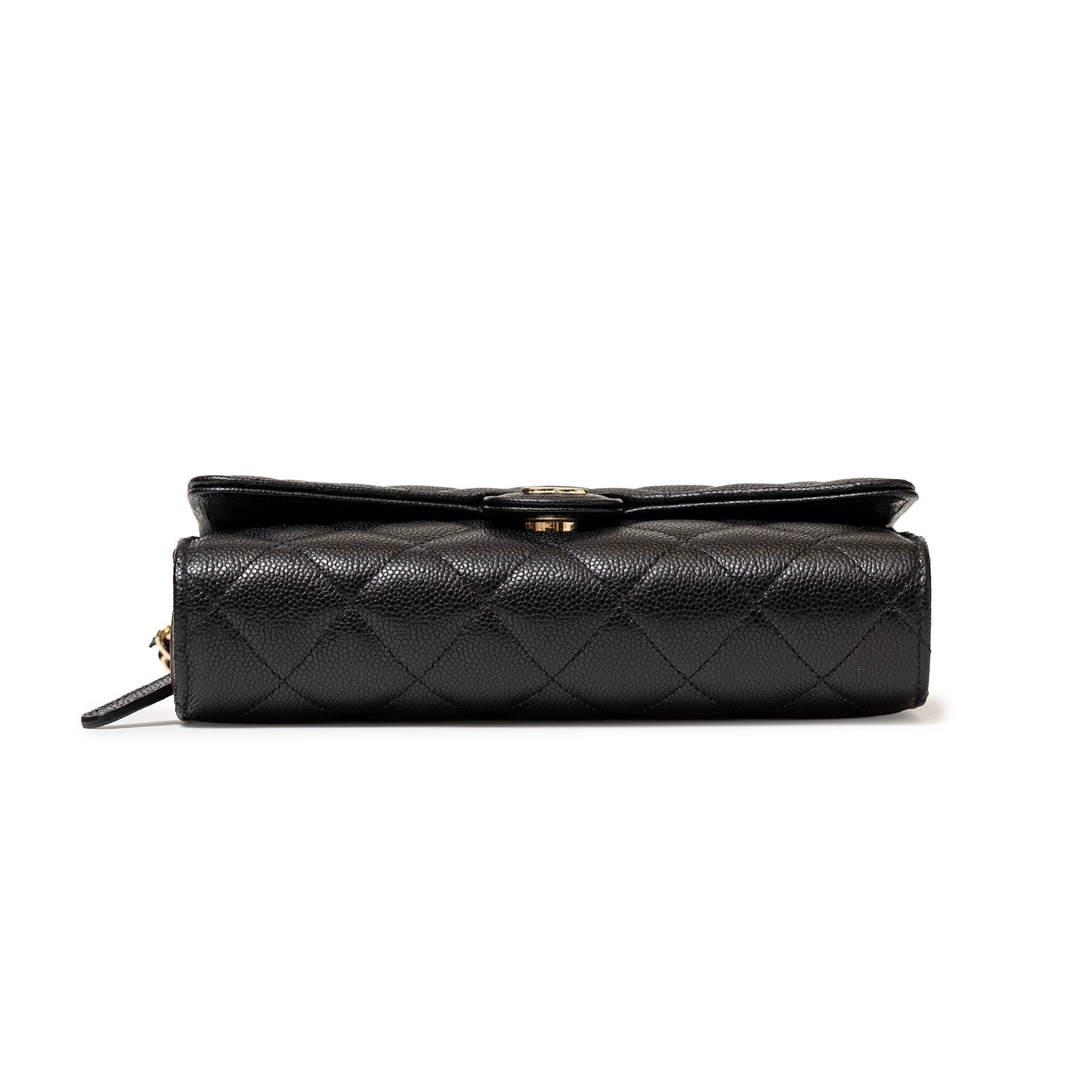 Bottom view of Chanel 24S Classic Clutch On Chain Caviar Black Gold Hardware showing textured quilting detail