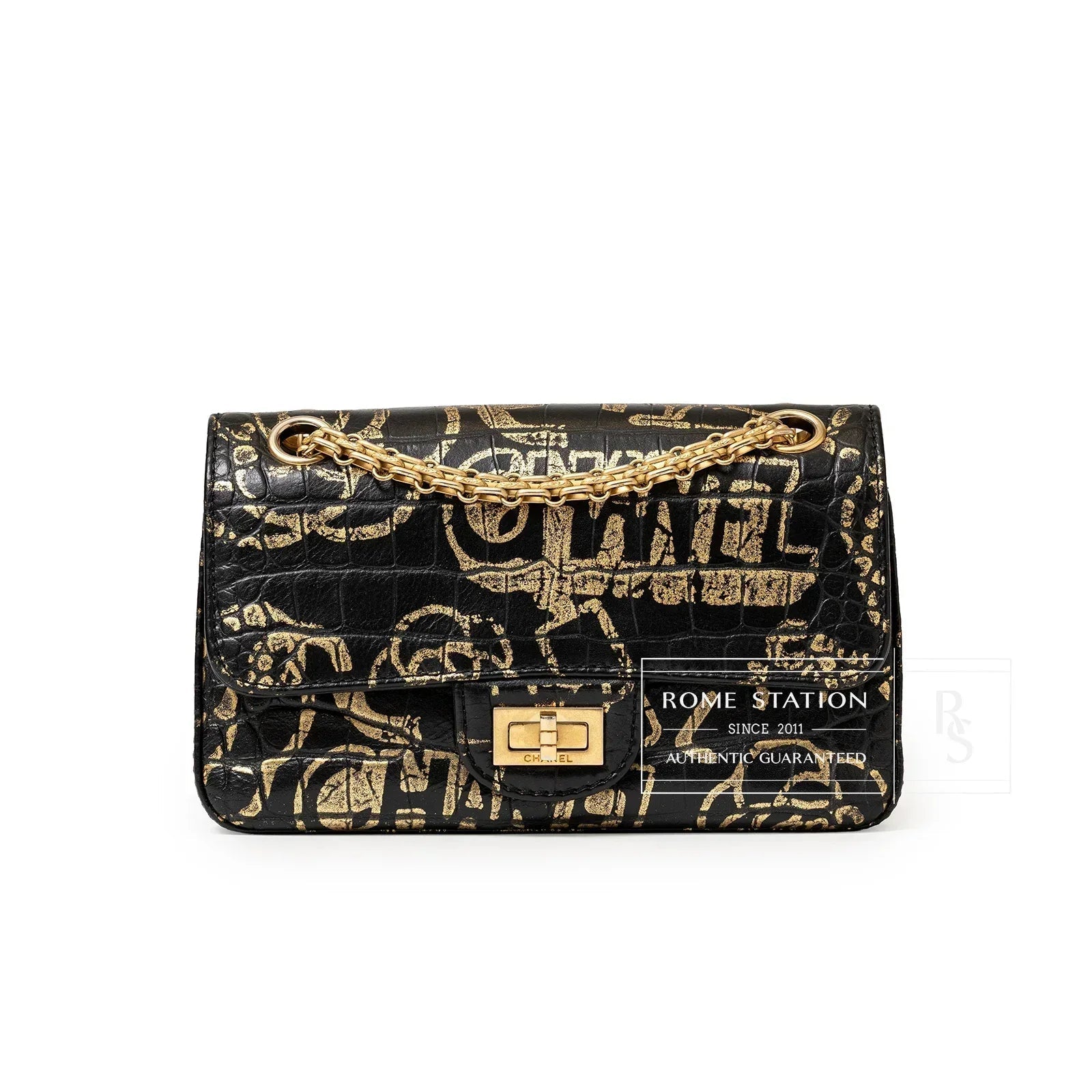 Front view of Chanel 2.55 Reissue 224 Flap Bag Black and Gold Graffiti Crocodile Embossed Calfskin Gold Hardware showing clasp detail