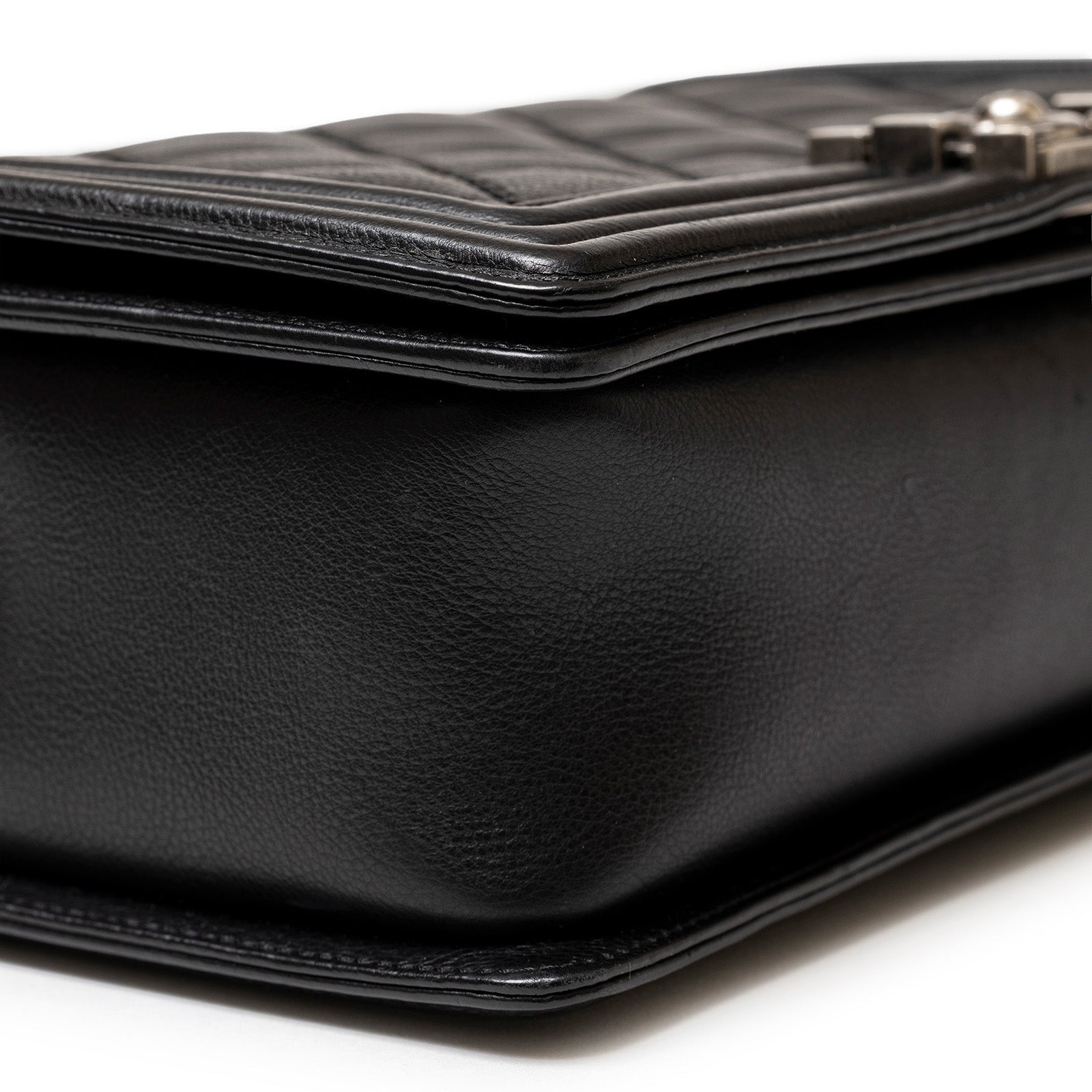 Close-up bottom corner view of Chanel Leboy Double Stitch Flap Black Palladium Hardware showing leather texture and stitching details