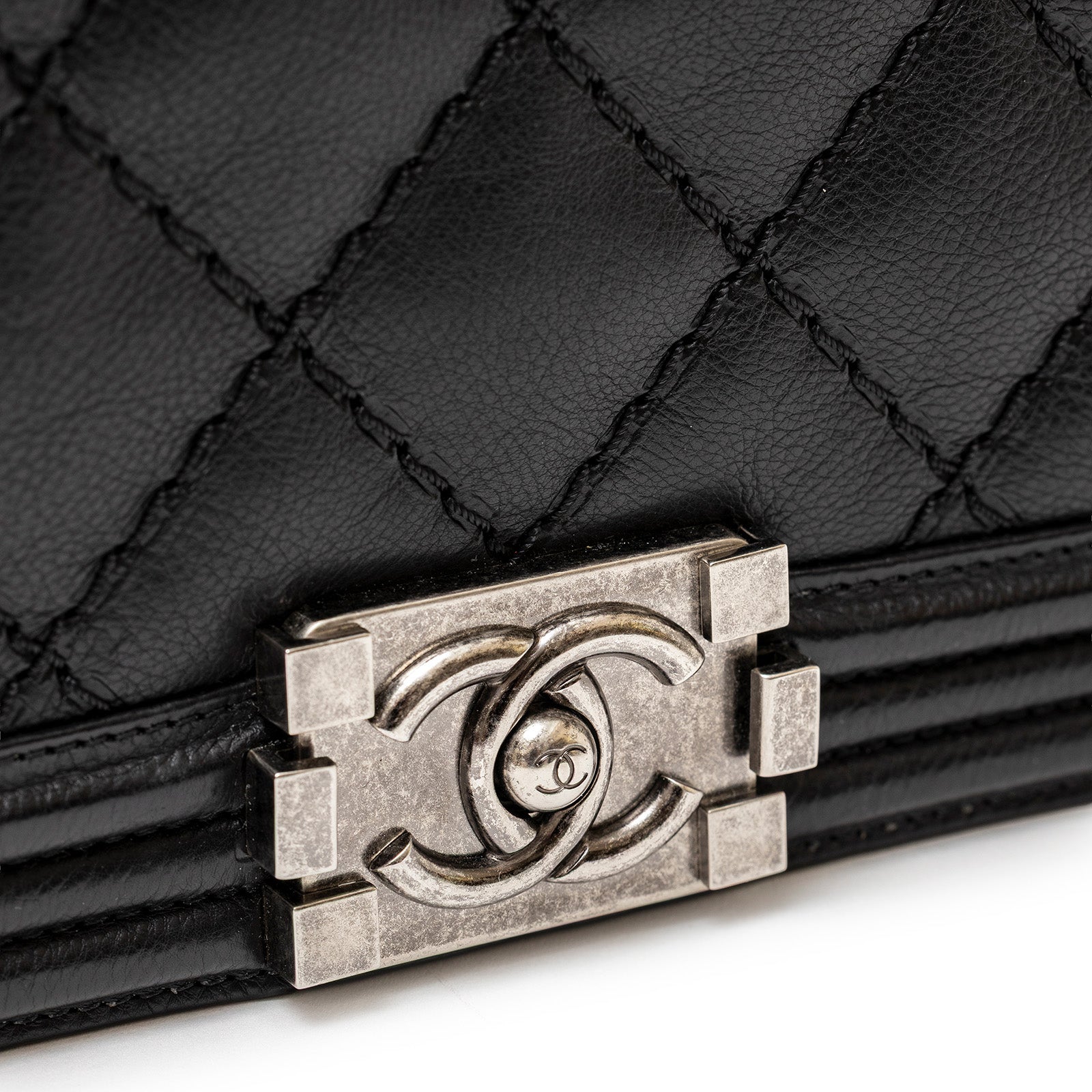 Close-up of Chanel Leboy Double Stitch Flap Black Palladium Hardware showing textured leather and clasp details
