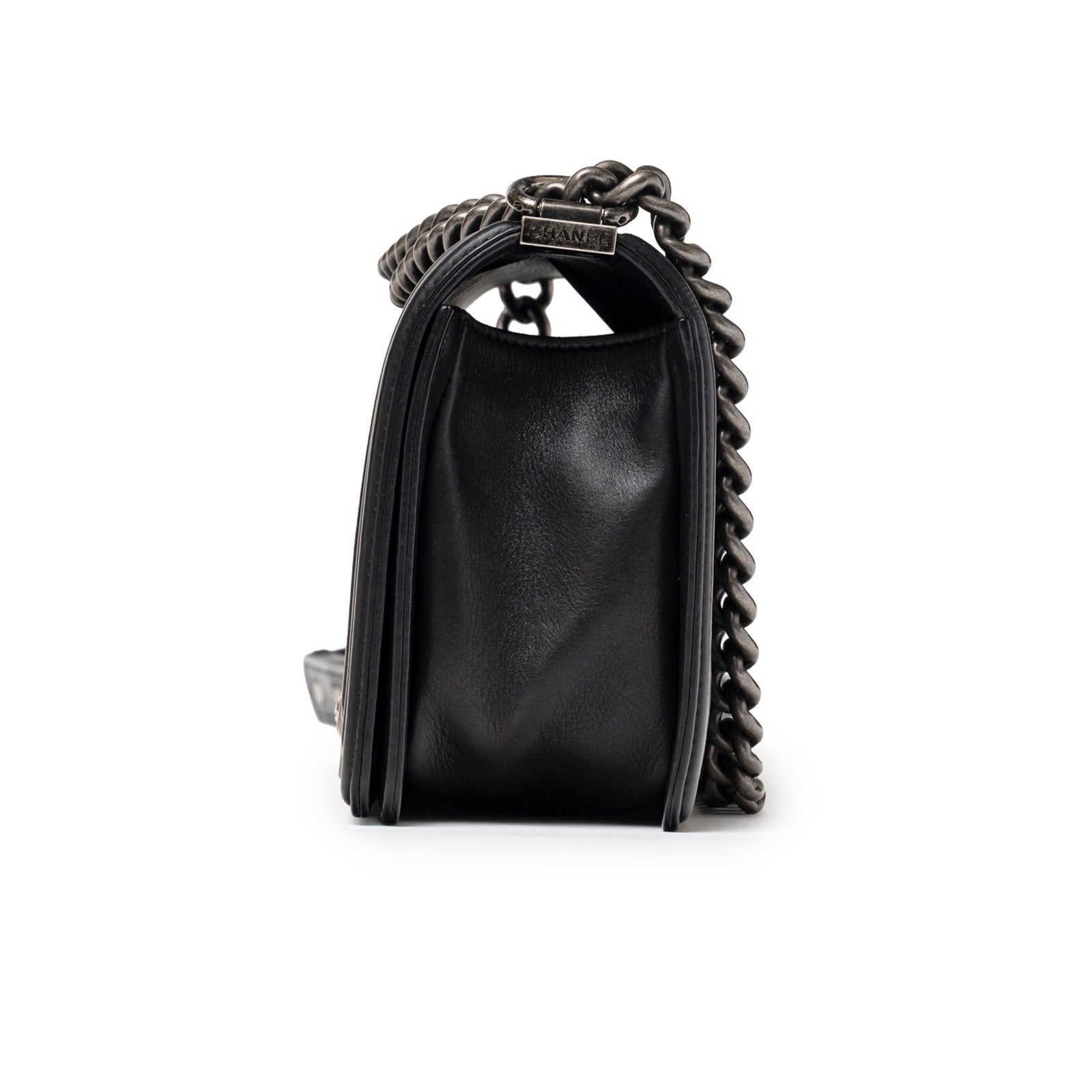 Side profile of Chanel Boy Bag Medium Black Lambskin Ruthenium Hardware showing chain strap detail