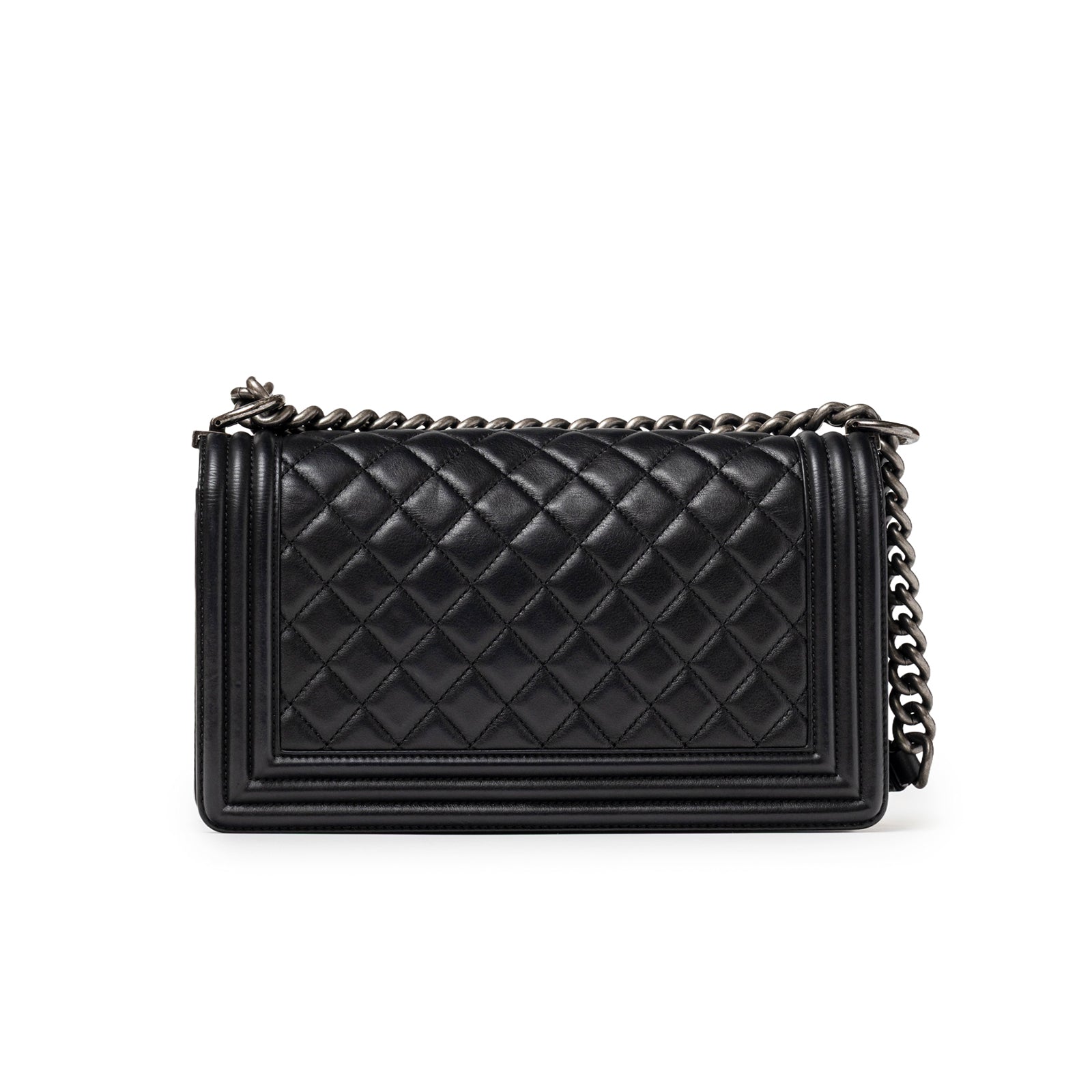 Back view of Chanel Boy Bag Medium Black Lambskin Ruthenium Hardware with quilted detail and chain strap