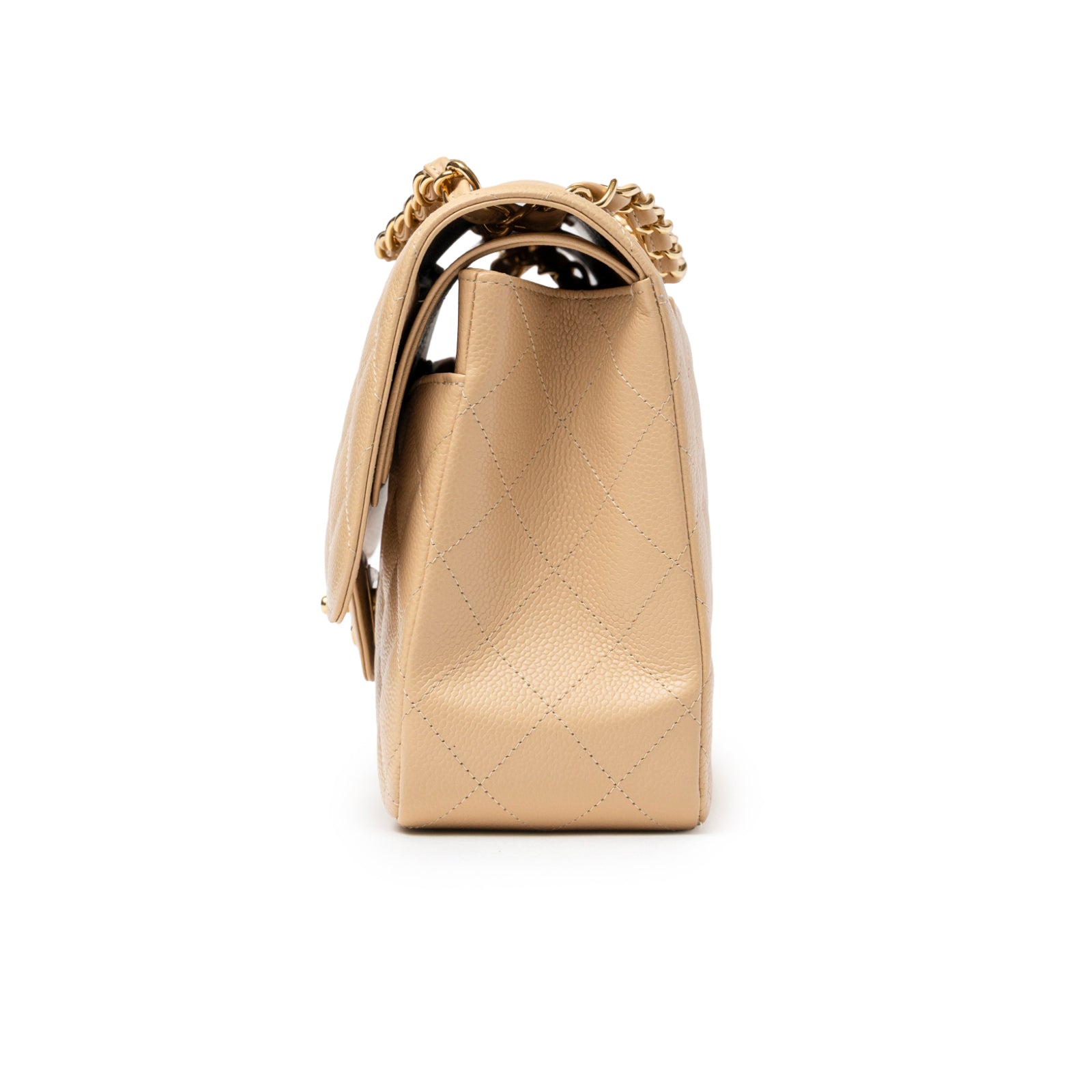 Side view of Chanel Classic Flap Jumbo Caviar Beige Gold Hardware bag showing quilted leather texture and chain strap