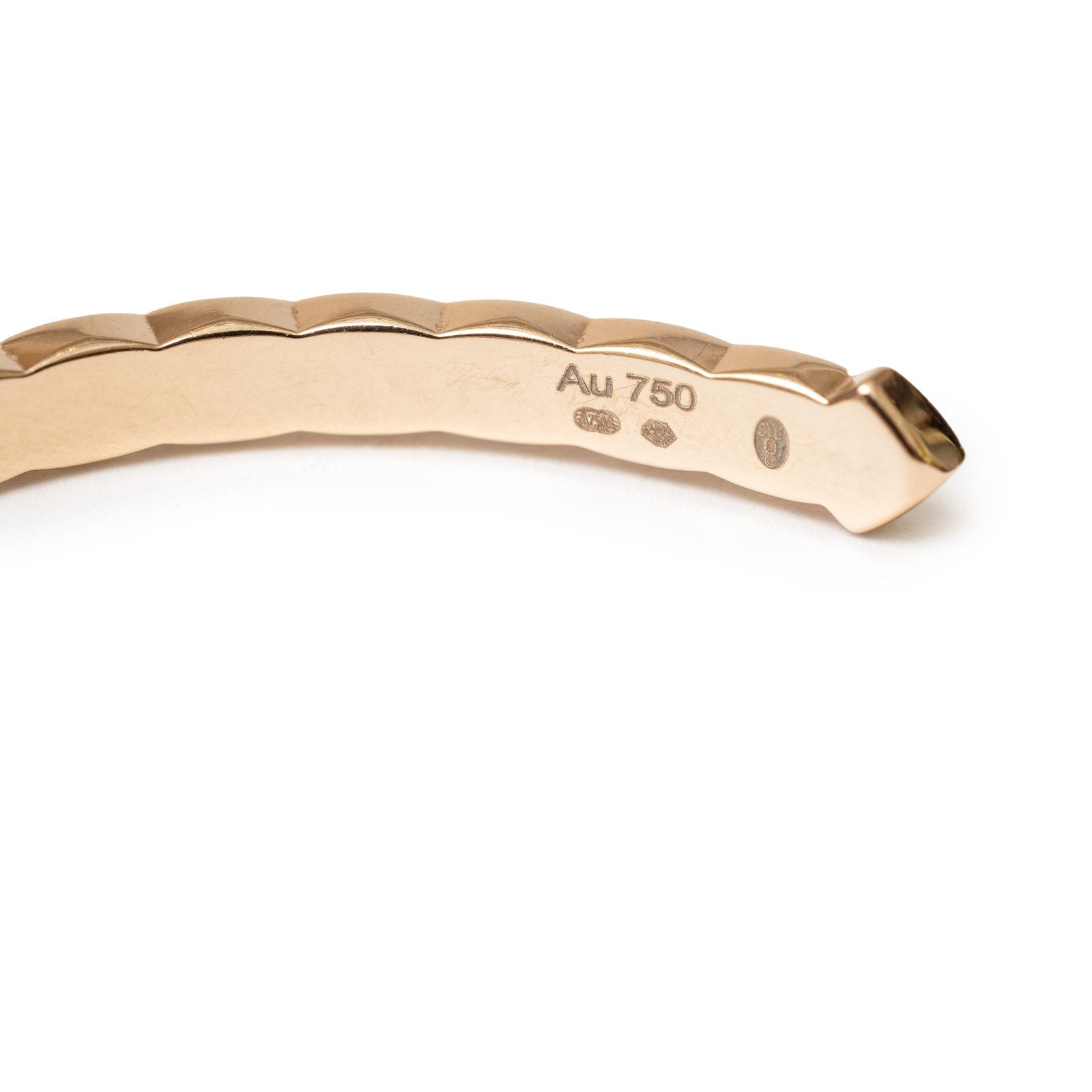 Close-up of Chanel Coco Crush Mini Bracelet 18K Gold Au750 showing gold purity markings and unique texture