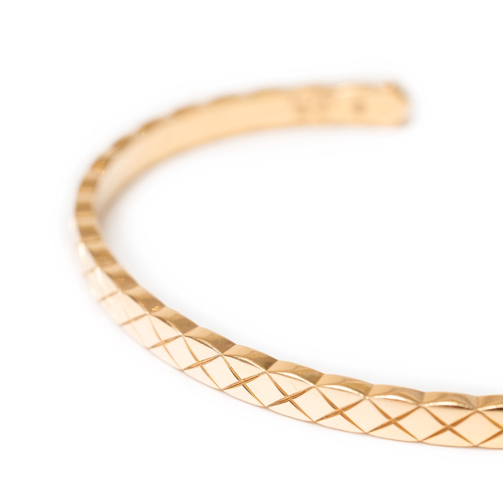 Close-up angled view of Chanel Coco Crush Mini Bracelet 18K Gold Au750 showcasing the quilted pattern detail