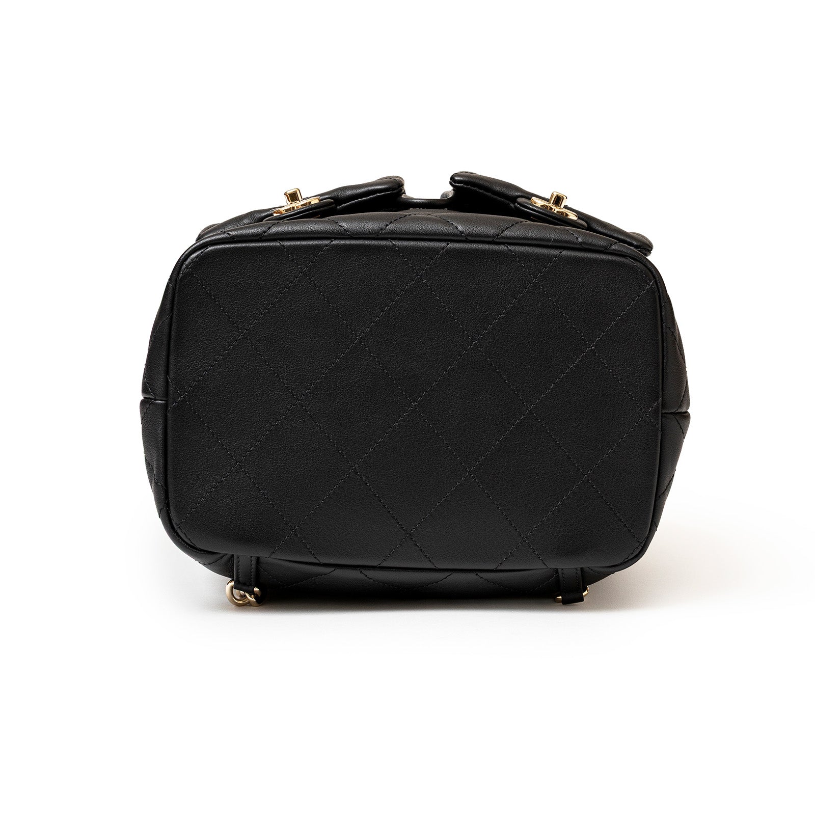 Bottom view of Chanel Coco Mellow Backpack Calf Black Permabrass Hardware 23B showing quilted leather detail