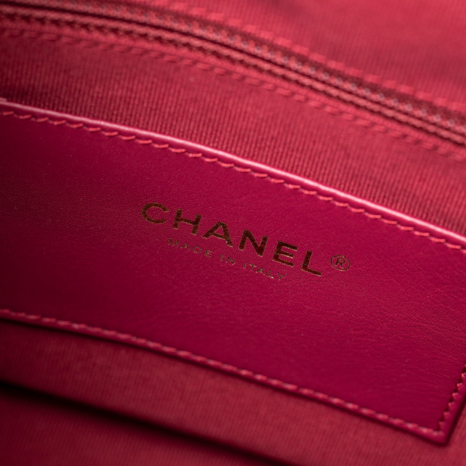 Close-up of interior label on Chanel Coco Mellow Backpack Calf Black Permabrass Hardware 23B showing Made in Italy text