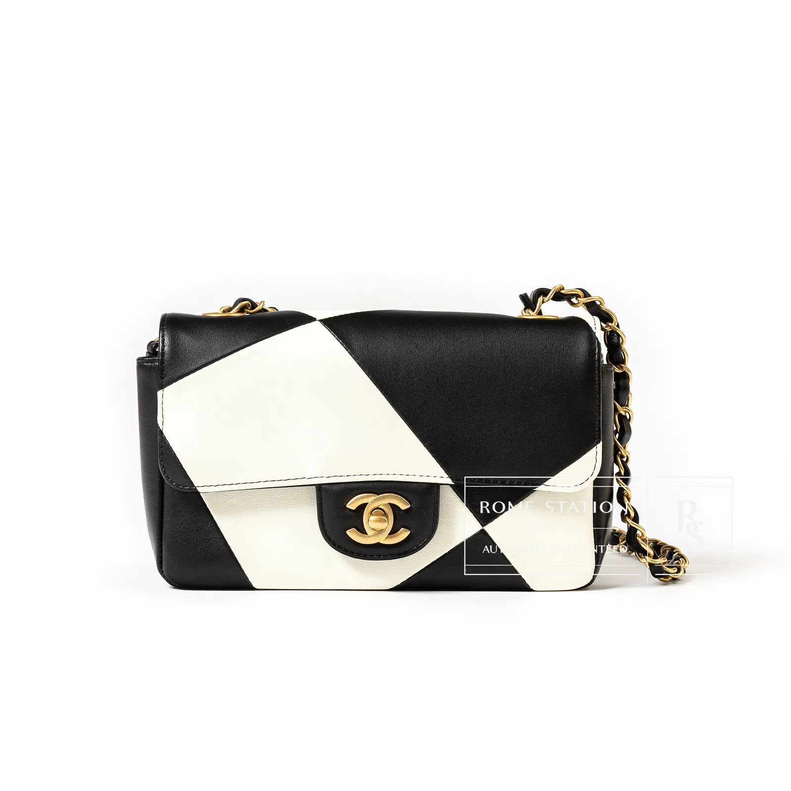 Front view of Chanel Geometric Patchwork Mini Flapbag Gold Hardware in black white leather with gold chain strap