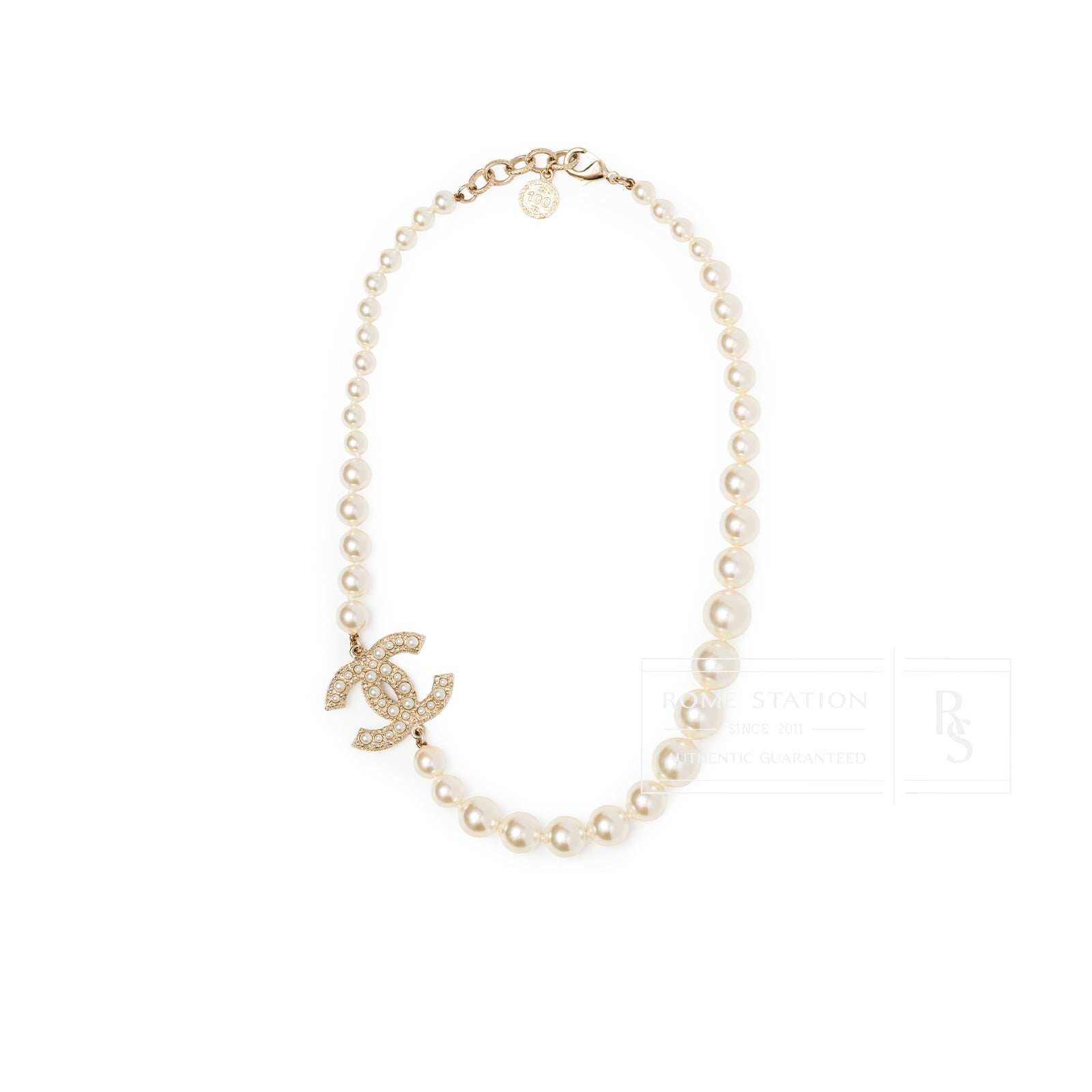 Top-down view of Chanel Graduated Pearl CC Short Necklace Gold featuring graduated pearls and gold CC logo charm embellished with crystals.