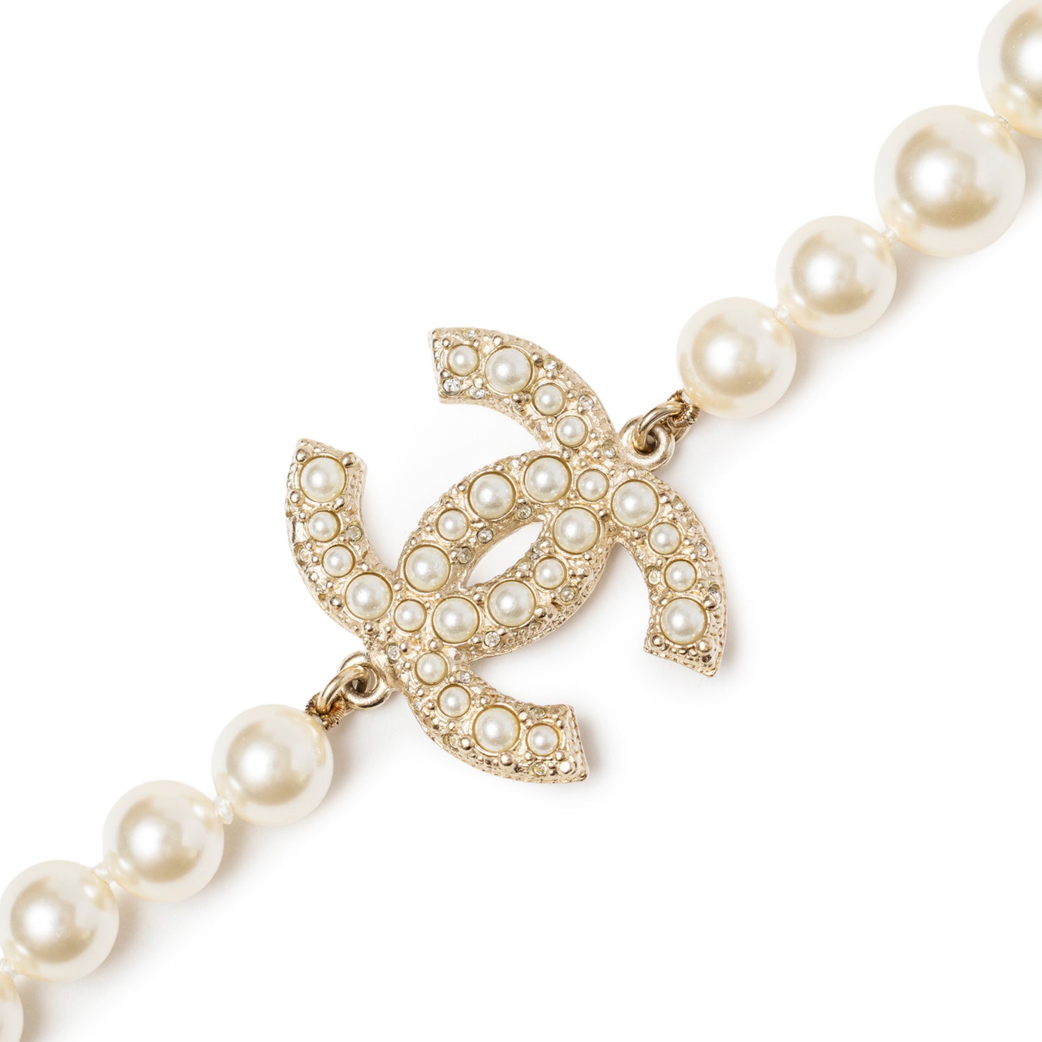 Close-up of Chanel Graduated Pearl CC Short Necklace Gold showcasing pearl-studded interlocking CC logo and lustrous pearls