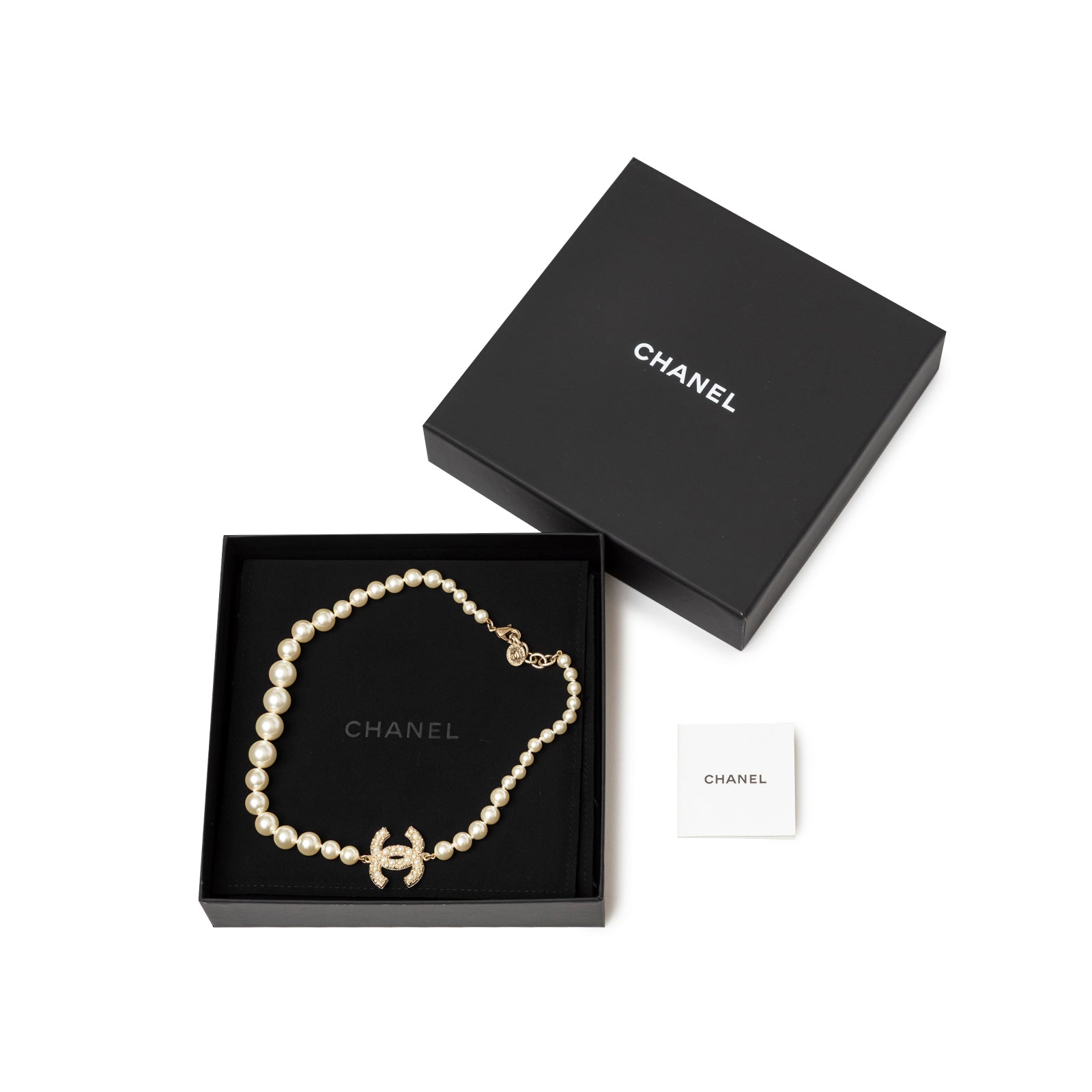 Chanel Graduated Pearl CC Short Necklace Gold displayed in black box with logo and small card accessory