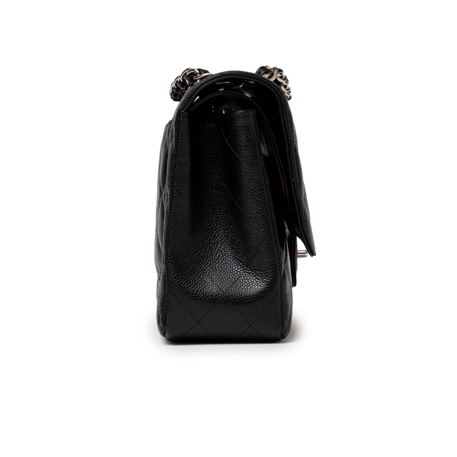 Side profile of Chanel Jumbo Classic Double Flap Caviar Black Palladium Hardware highlighting quilted pebbled leather texture