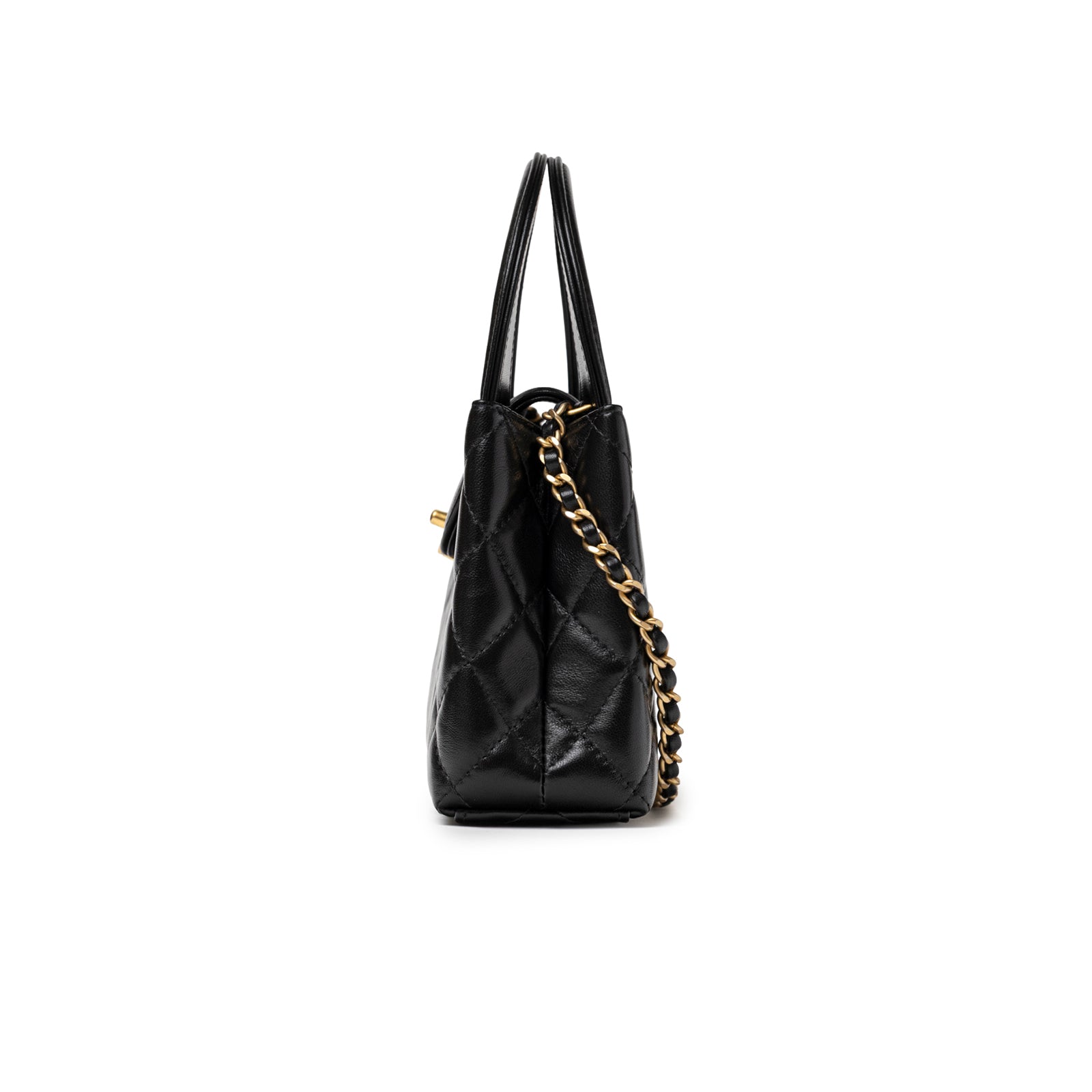 Side profile of Chanel Kelly Shopper Small Black Shiny Aged Calfskin Brushed Gold Hardware with chain strap detail