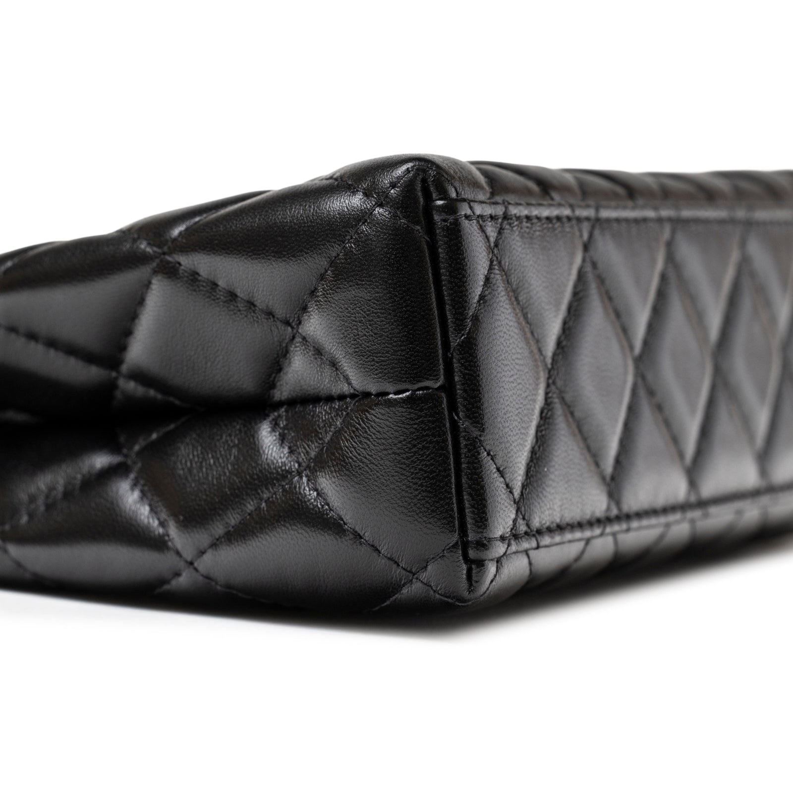 Close-up of quilted corner on Chanel Kelly Shopper Small Black Shiny Aged Calfskin Brushed Gold Hardware