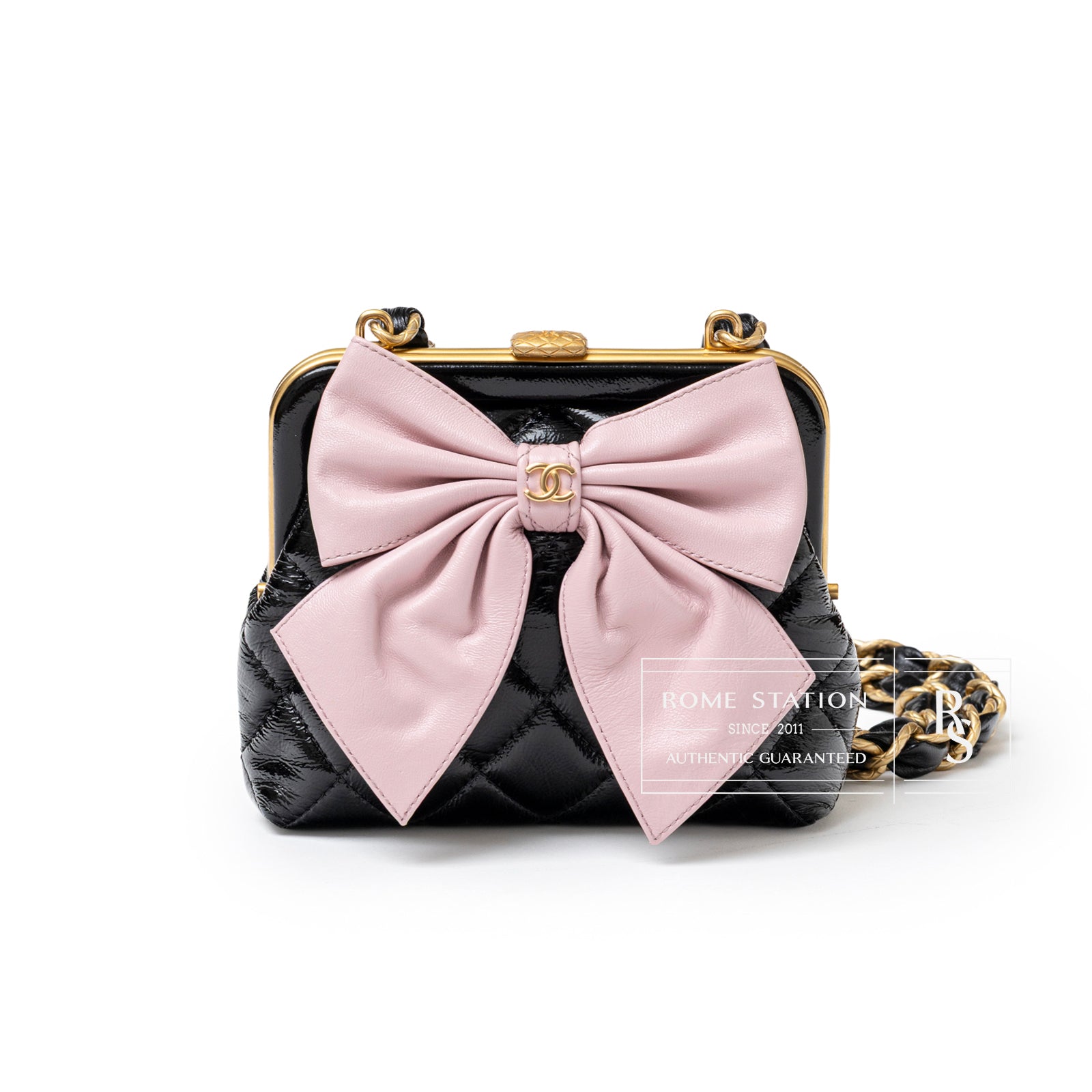 Front view of Chanel Maxi Bow Clutch With Chain Black/Pink Shiny Quilted Patent Crumpled/Lambskin Brushed Gold Hardware showing large pink bow and gold chain