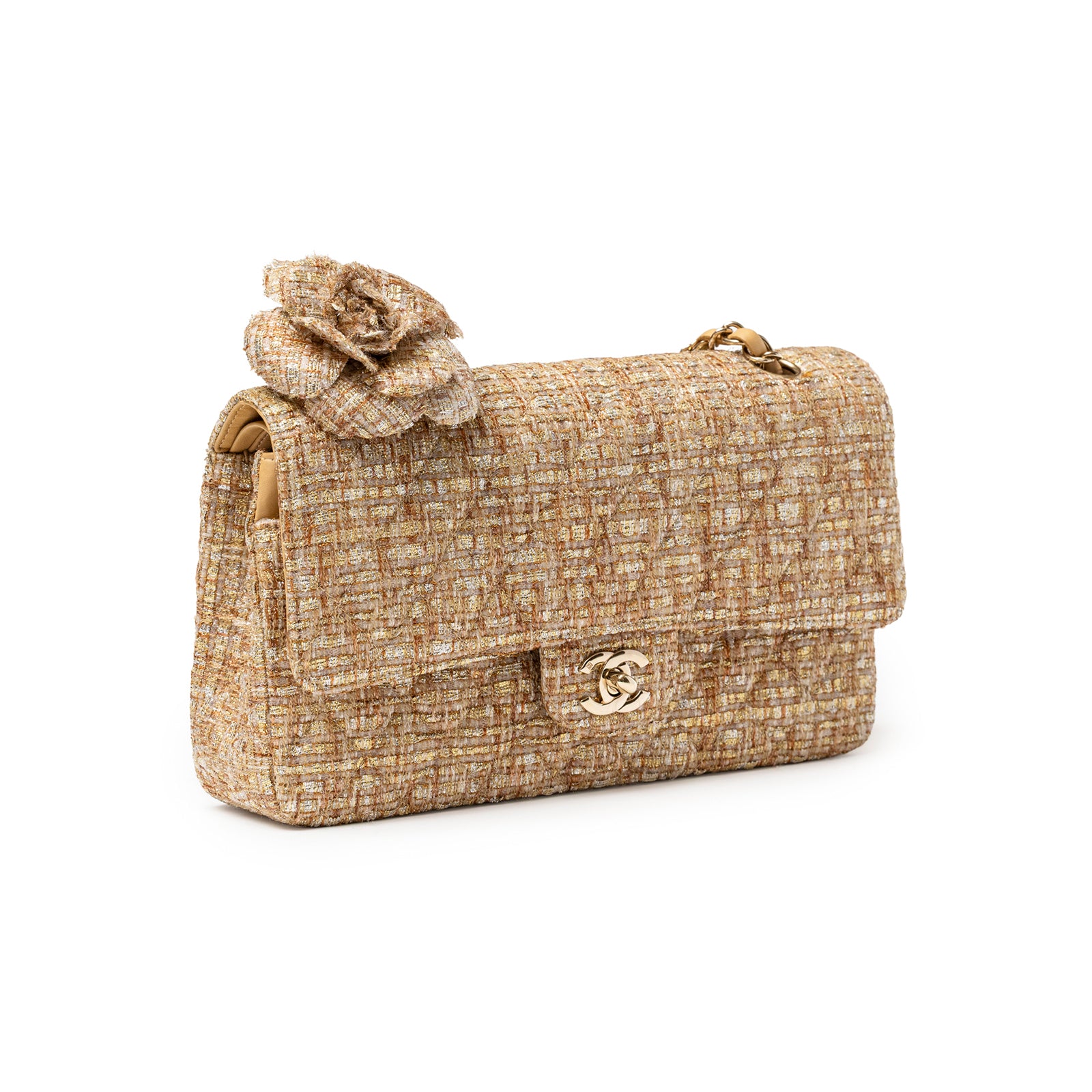 Angled view of Chanel Classic Double Flap Medium Gold Beige Tweed Gold Hardware with camellia brooch