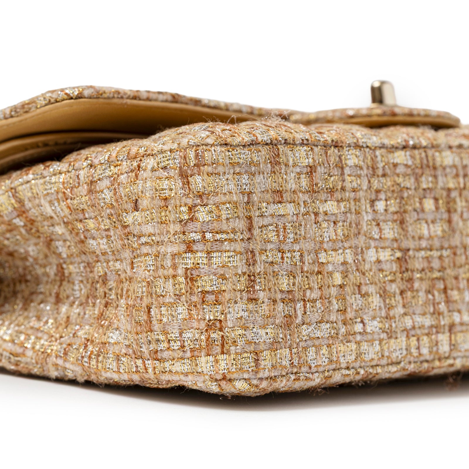 Close-up of the textured tweed fabric and stitching on Chanel Classic Double Flap Medium Gold Beige Tweed Gold Hardware base.