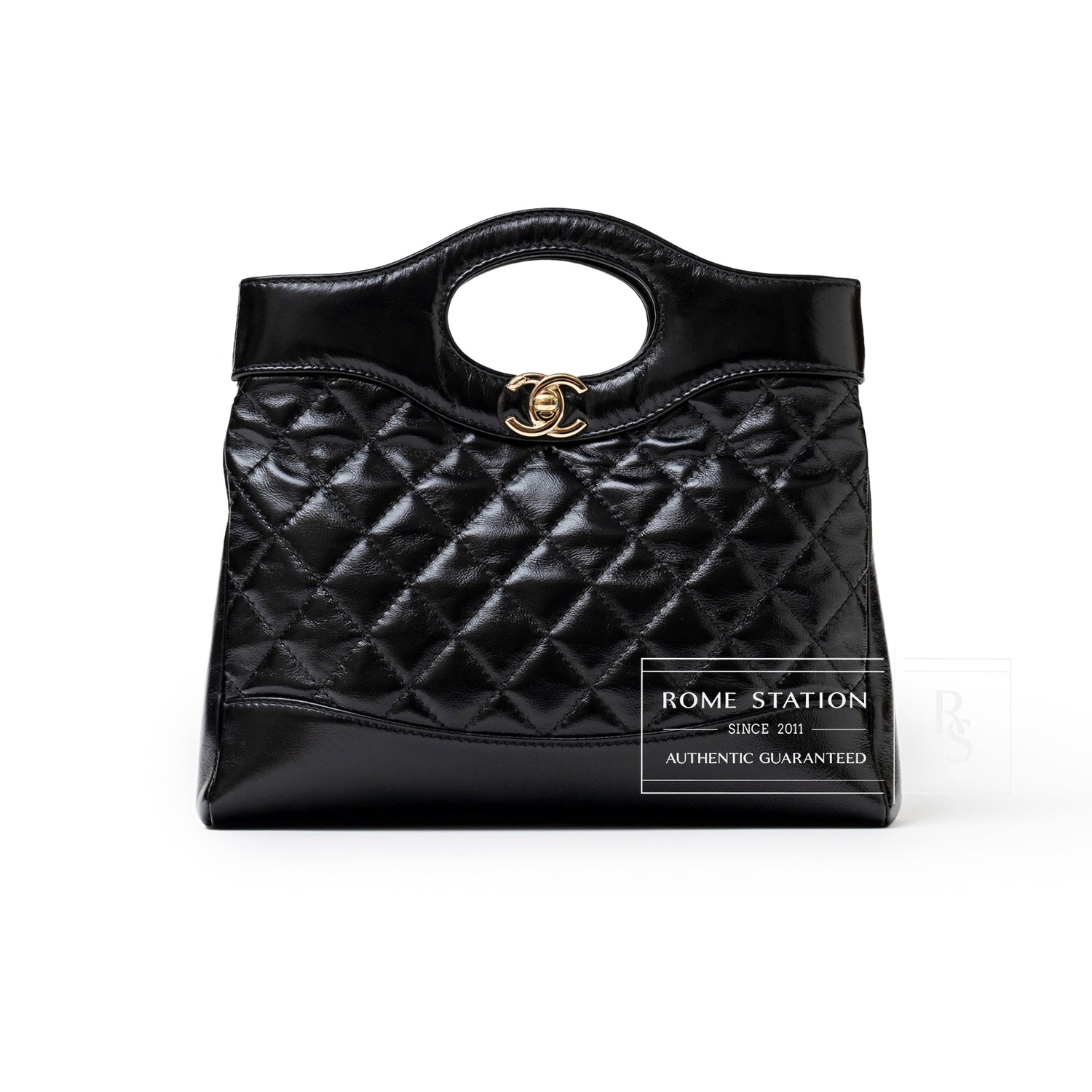 Front view of Chanel Mini 31 Shopping Tote Calfskin Black Gold Hardware with quilted leather and logo clasp