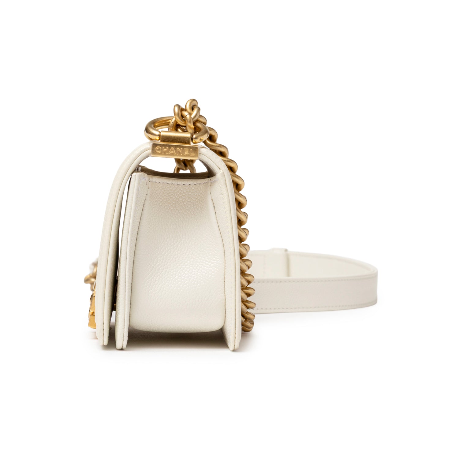Side angle of Chanel Mini Boy Bag White Caviar Gold Hardware showing structured silhouette and chain strap detail