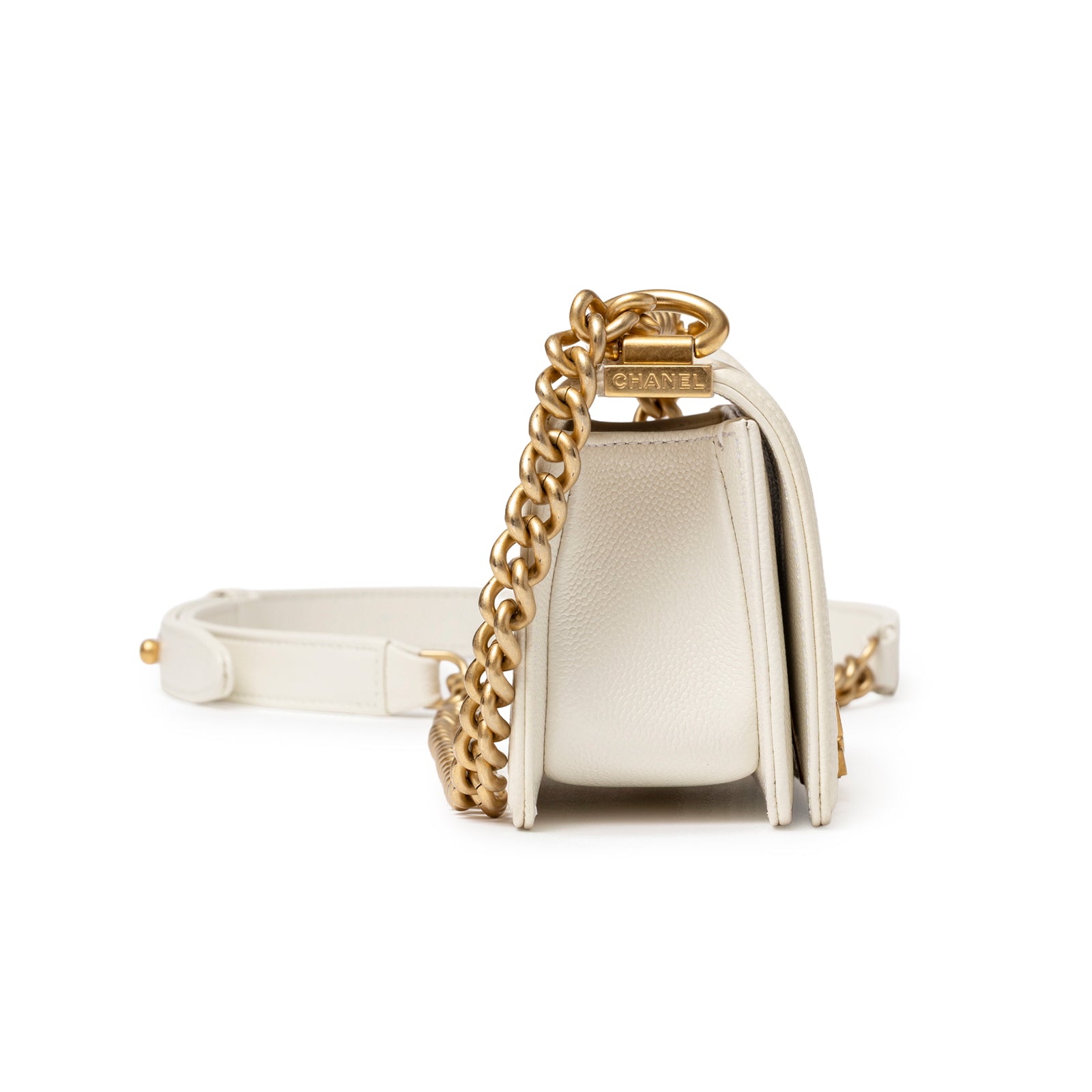 Side view of Chanel Mini Boy Bag White Caviar Gold Hardware with chain strap and textured leather