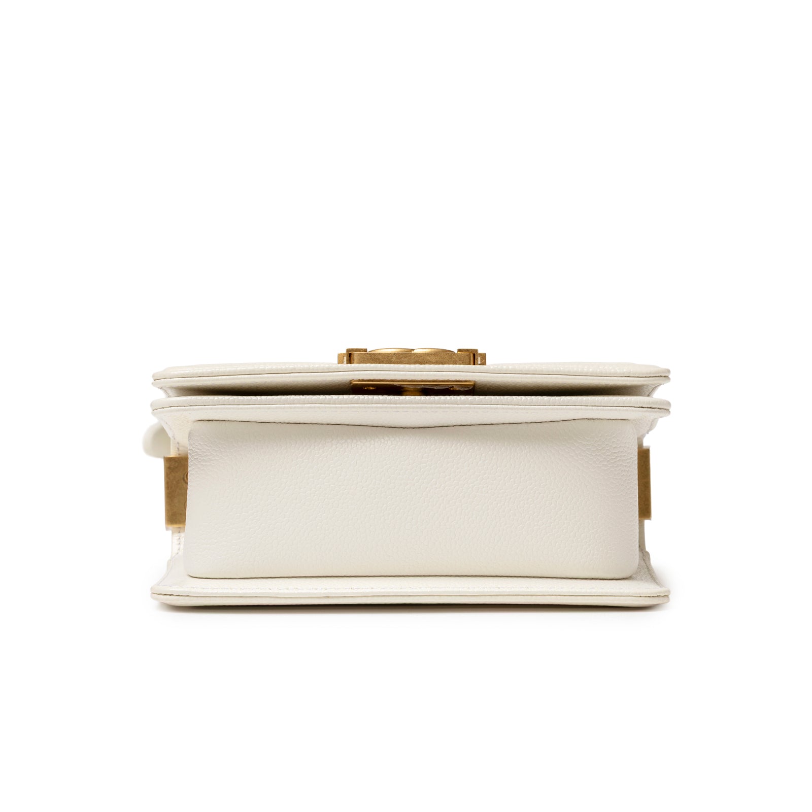Bottom view of Chanel Mini Boy Bag White Caviar Gold Hardware showing structured base and textured leather detail