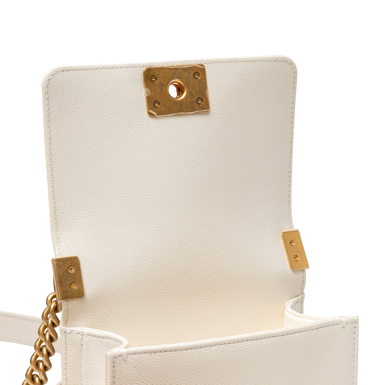 Open view of Chanel Mini Boy Bag White Caviar Gold Hardware showing interior and gold clasp details