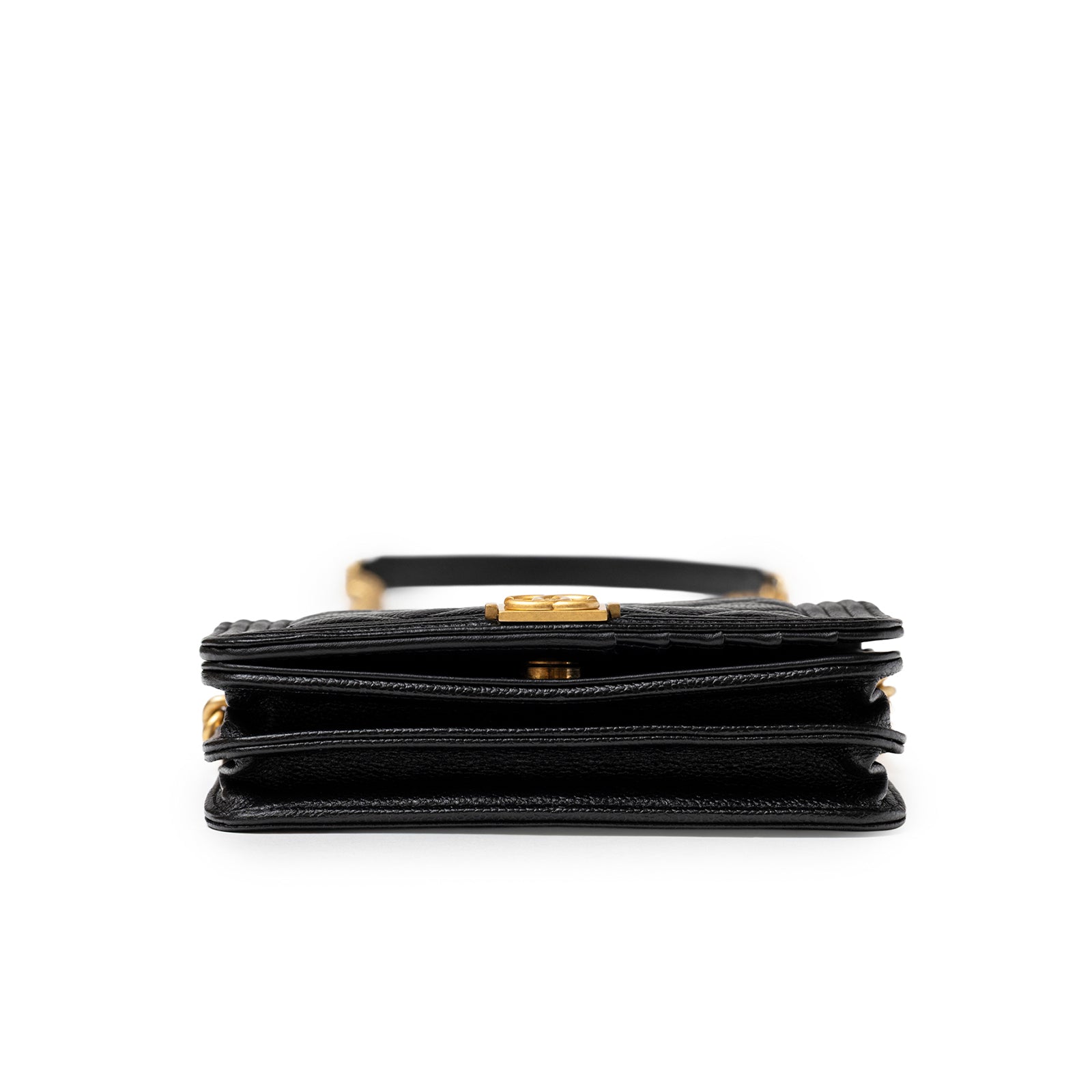 Bottom of Chanel Mini Boy Wallet on Chain Black Caviar Brushed Gold Hardware highlighting layered compartments and clasp edge