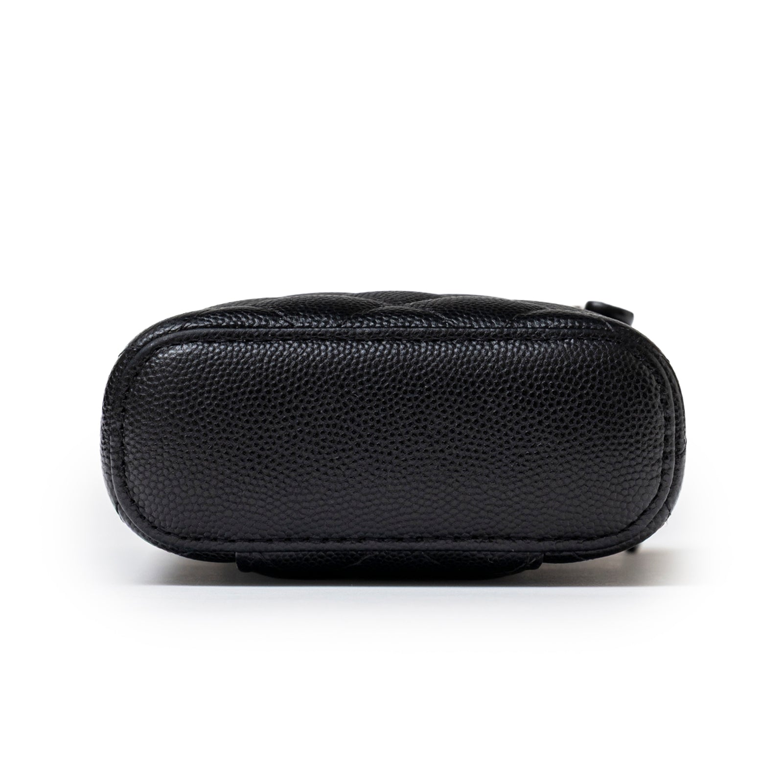 Bottom view of Chanel Mini Coco Beauty Vanity Case on Chain Black Caviar Gold Hardware showing textured leather base