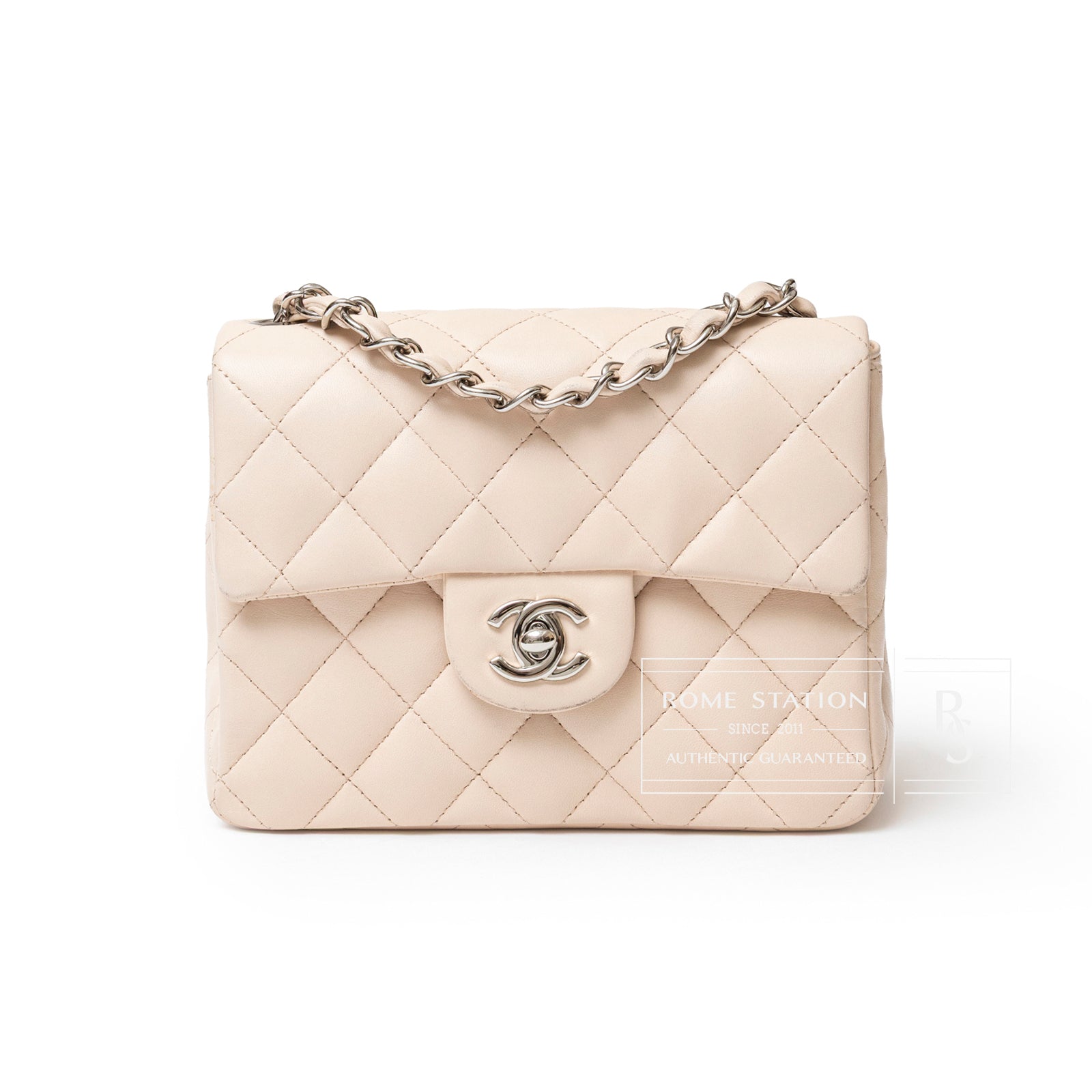 Front view of Chanel Mini Square Single Flap Lambskin Beige Silver Hardware bag with chain strap and logo clasp