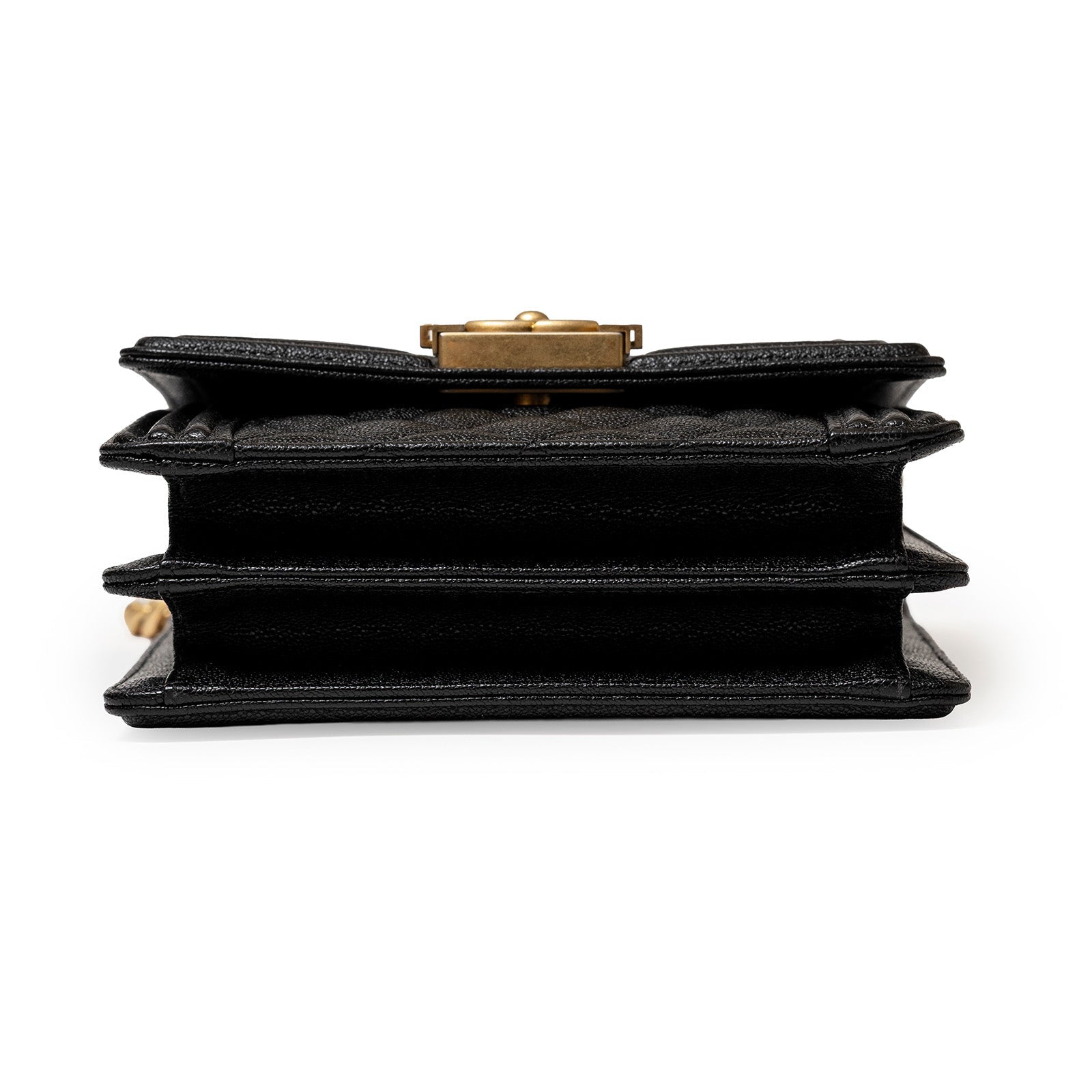 Bottom view of Chanel North South Boy Flap Bag Black Caviar Brushed Gold Hardware showing layered compartments and texture details