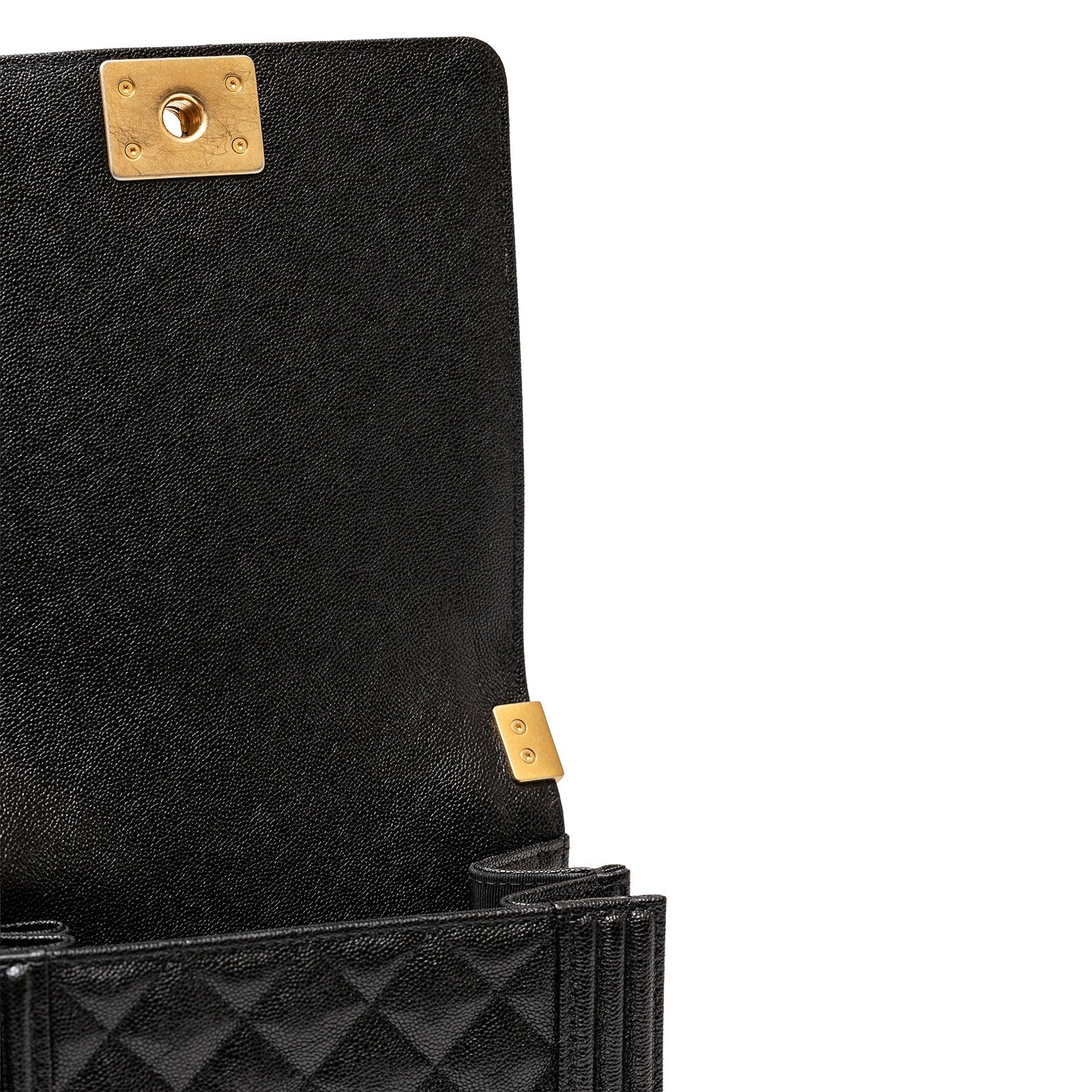 Interior view of Chanel North South Boy Flap Bag Black Caviar Brushed Gold Hardware showing clasp and quilted leather lining