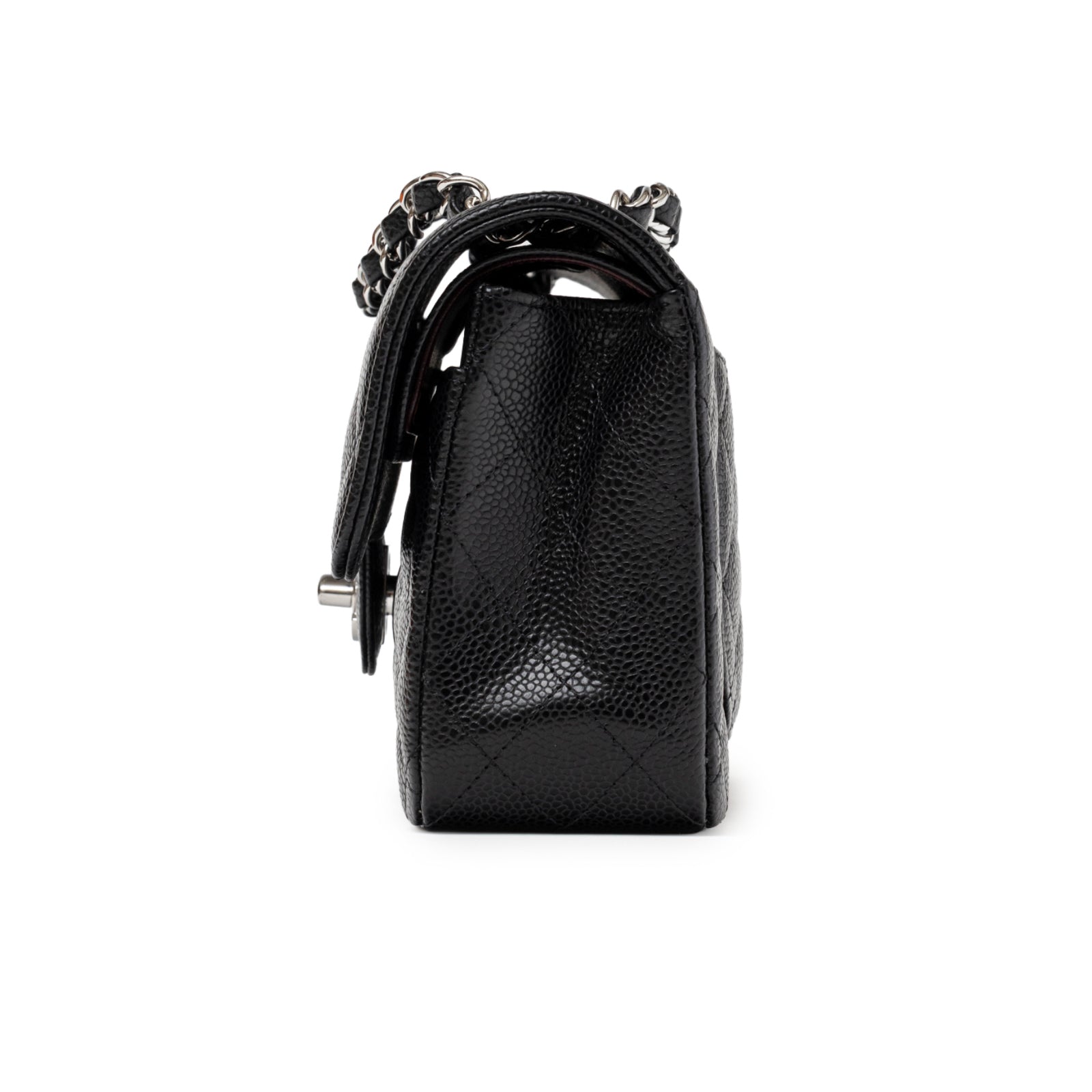 Side view of Chanel Small Classic Flap Bag Black Caviar Palladium Hardware showing its textured leather and chain strap detail