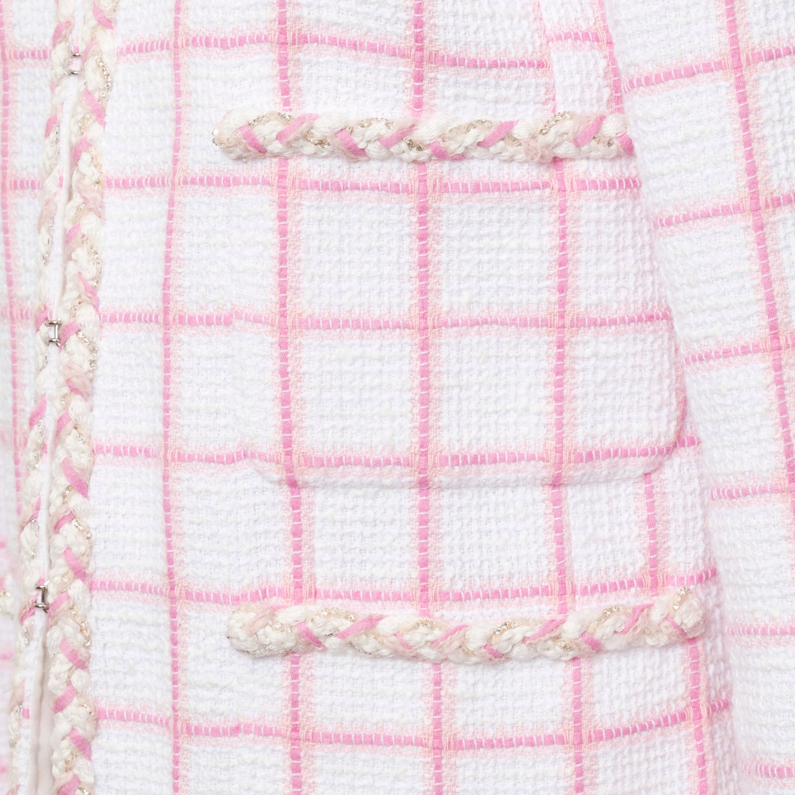 Close-up of pocket and braided trim detail on Chanel Tweed Jacket 23C White/Pink fabric texture
