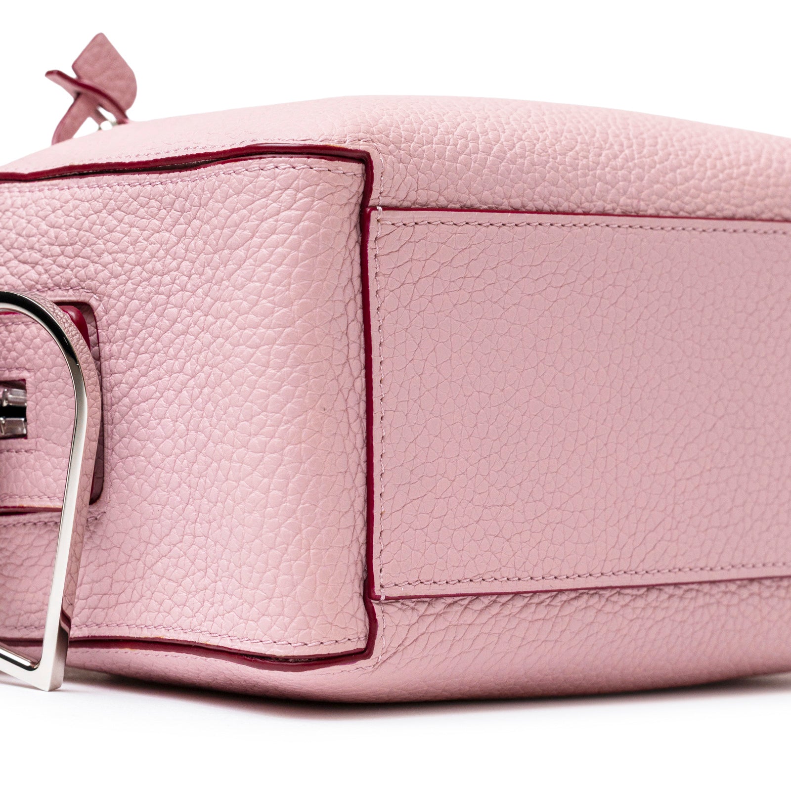 Close-up angled view of Delvaux Cool Box Mini Taurillon Soft Blush Palladium Hardware showing textured leather and stitching details